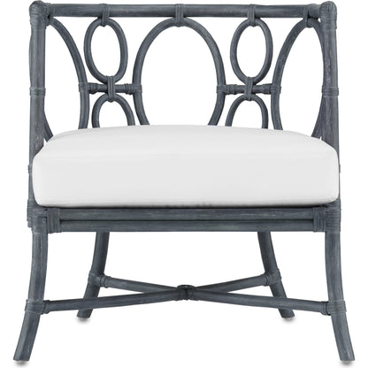 Tegal Chair by Currey and Company in vintage navy, indigo. Made from rattan, plywood, fabric, foam in a coastal style.