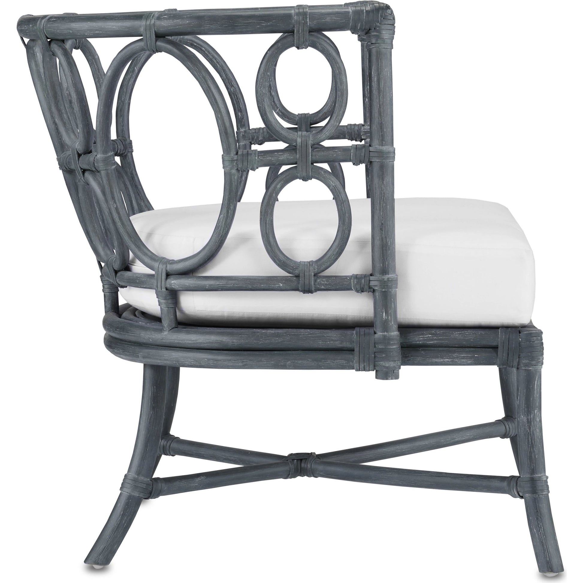 Tegal Chair by Currey and Company in vintage navy, indigo. Made from rattan, plywood, fabric, foam in a coastal style.