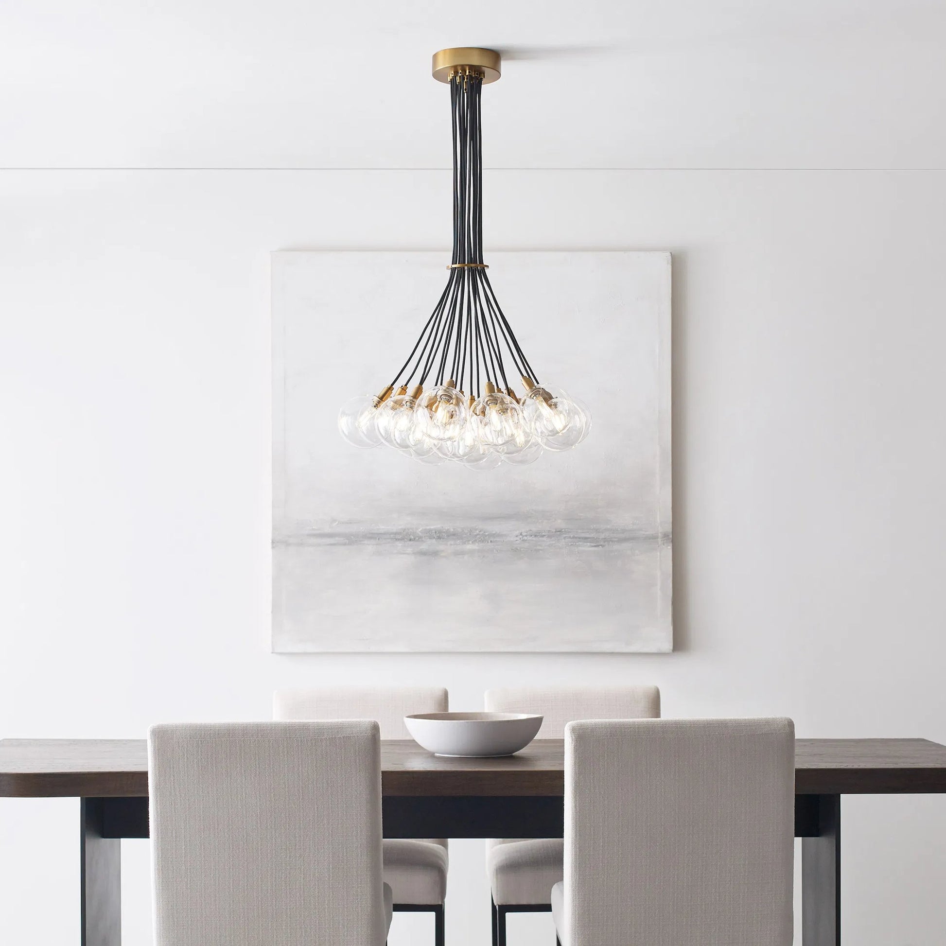 Gambit Multi-Port Chandelier by Tech Lighting in aged brass. Made from glass in a modern style.