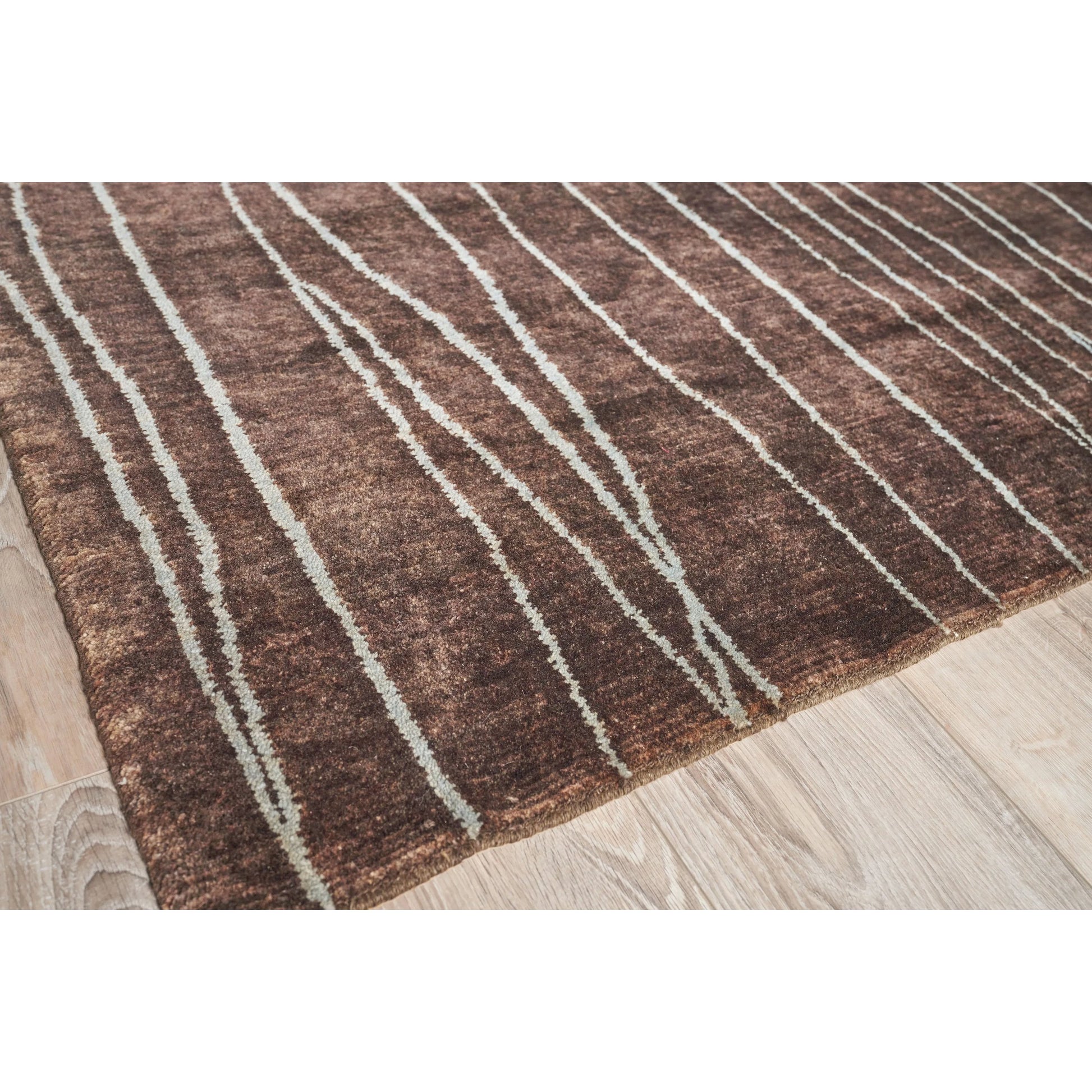 Metro 7033 Rug by Exquisite Rugs in brown. Made from new zealand wool in a unique style.