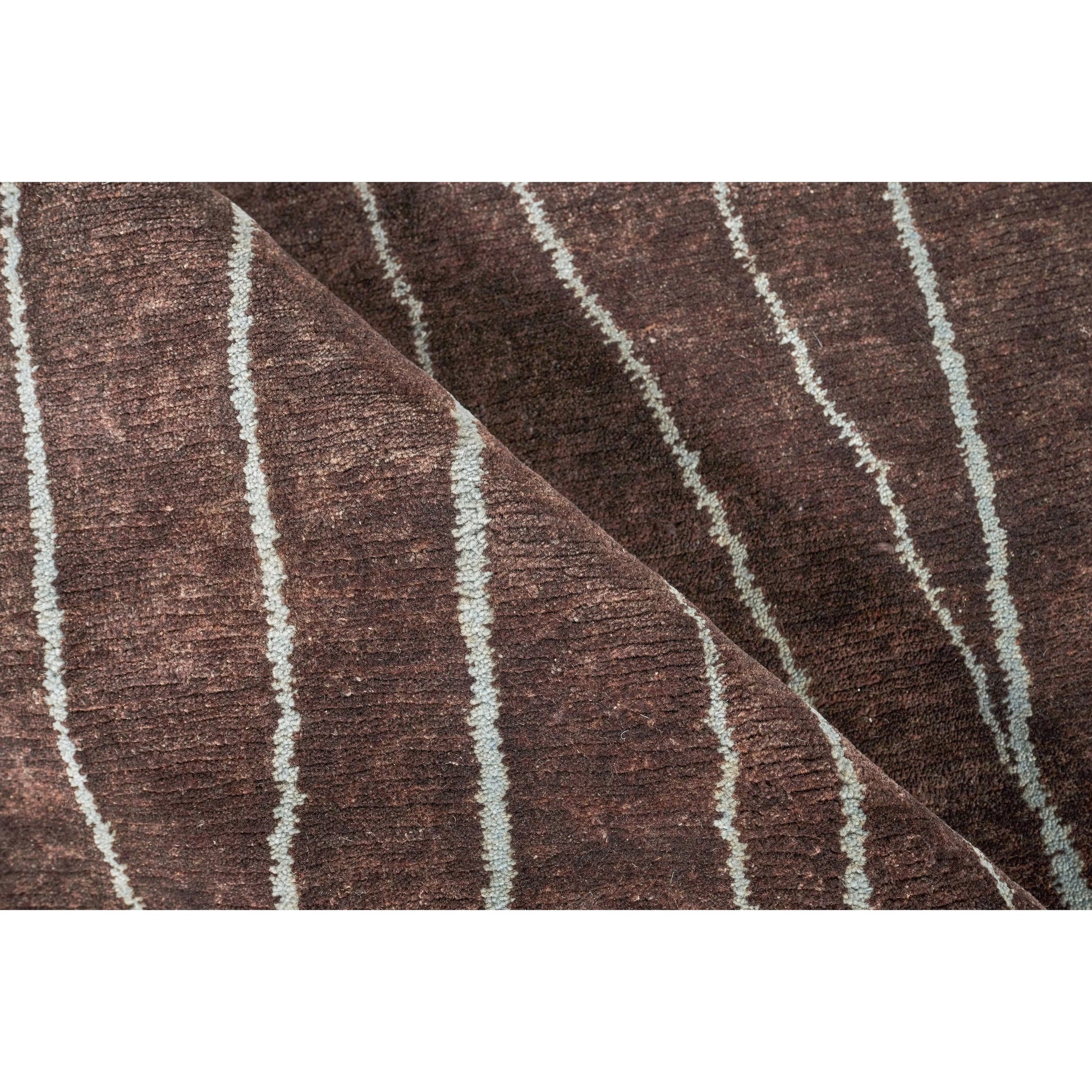 Metro 7033 Rug by Exquisite Rugs in brown. Made from new zealand wool in a unique style.
