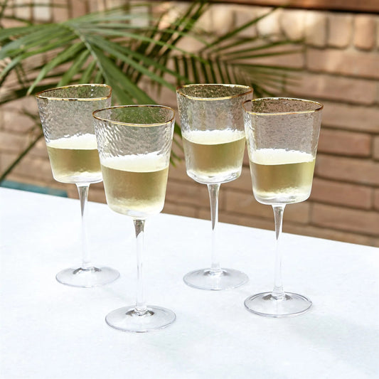S/4 Hammered Wine Glasses by Global Views in clear and gold. Made from unique in a unique style.