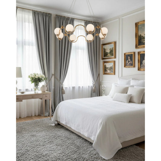 Equilibrium Chandelier by Currey and Company in antique brass, white. Made from wrought iron, glass in a modern style.