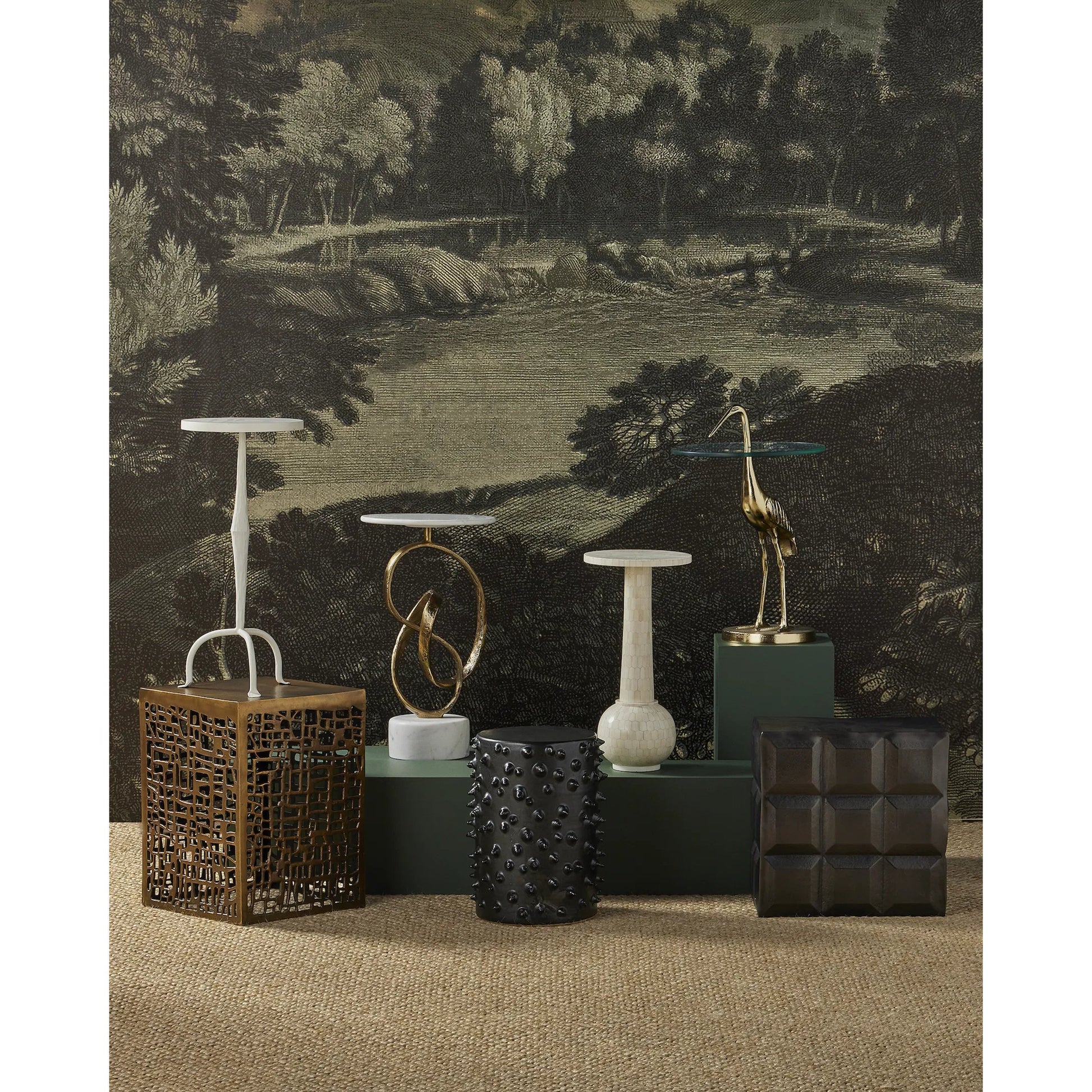 Gowen Accent Table by Currey and Company in antique brass. Made from cast aluminum in a modern style.