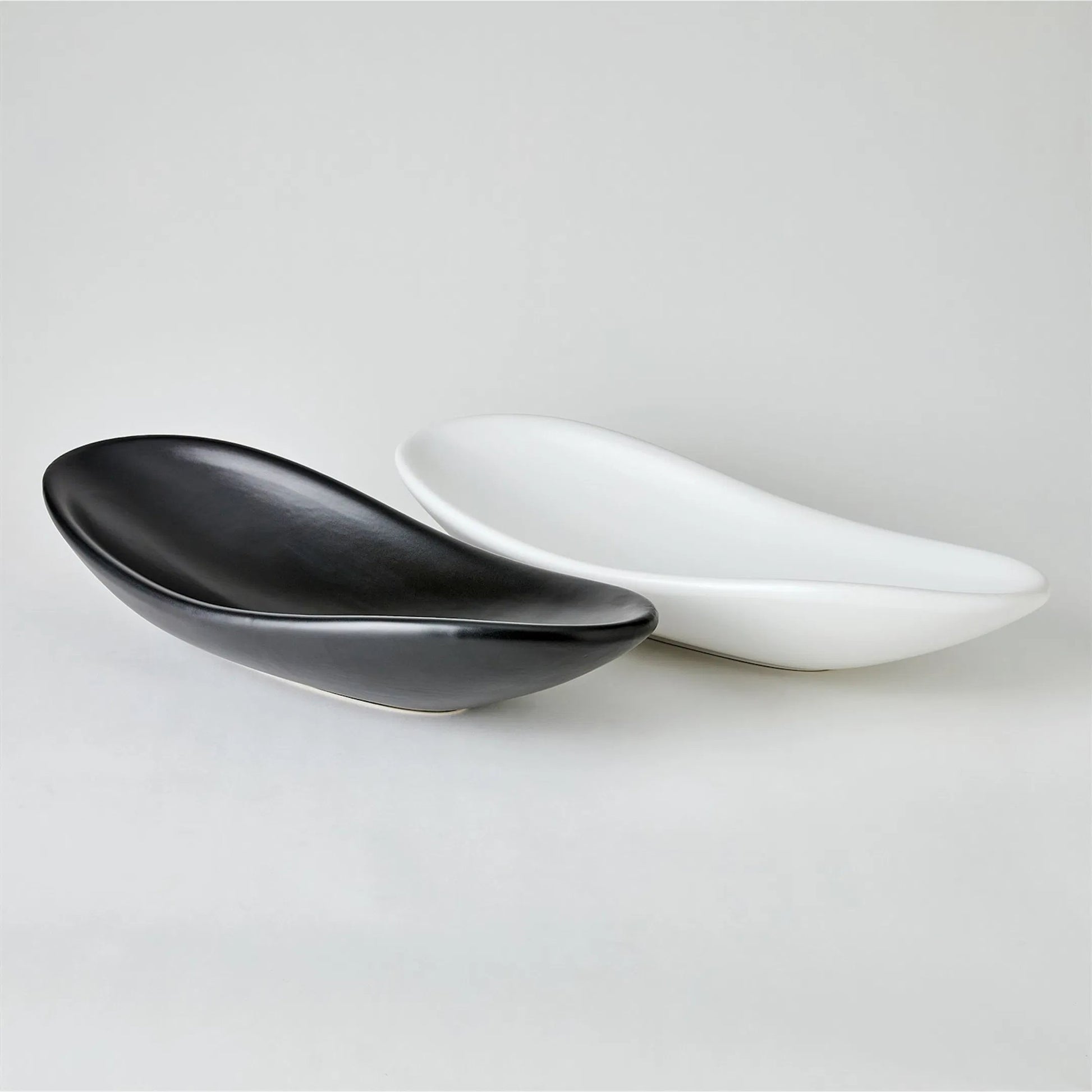 Oblong Platter Bowl by Global Views. Made from ceramic in a modern style.