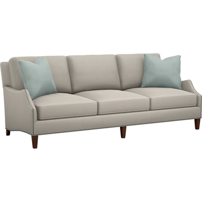 Ashton Sofa by Lexington in tan and brown. Made from mahogany, fabric in a unique style.