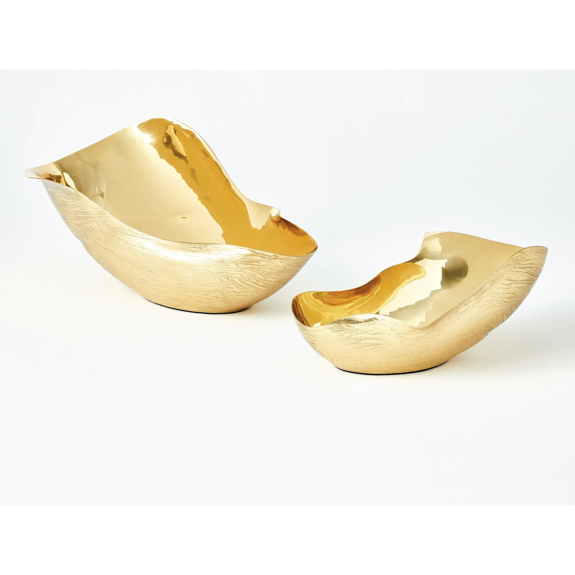 Free Form Bowl by Global Views. Made from brass in a modern style.