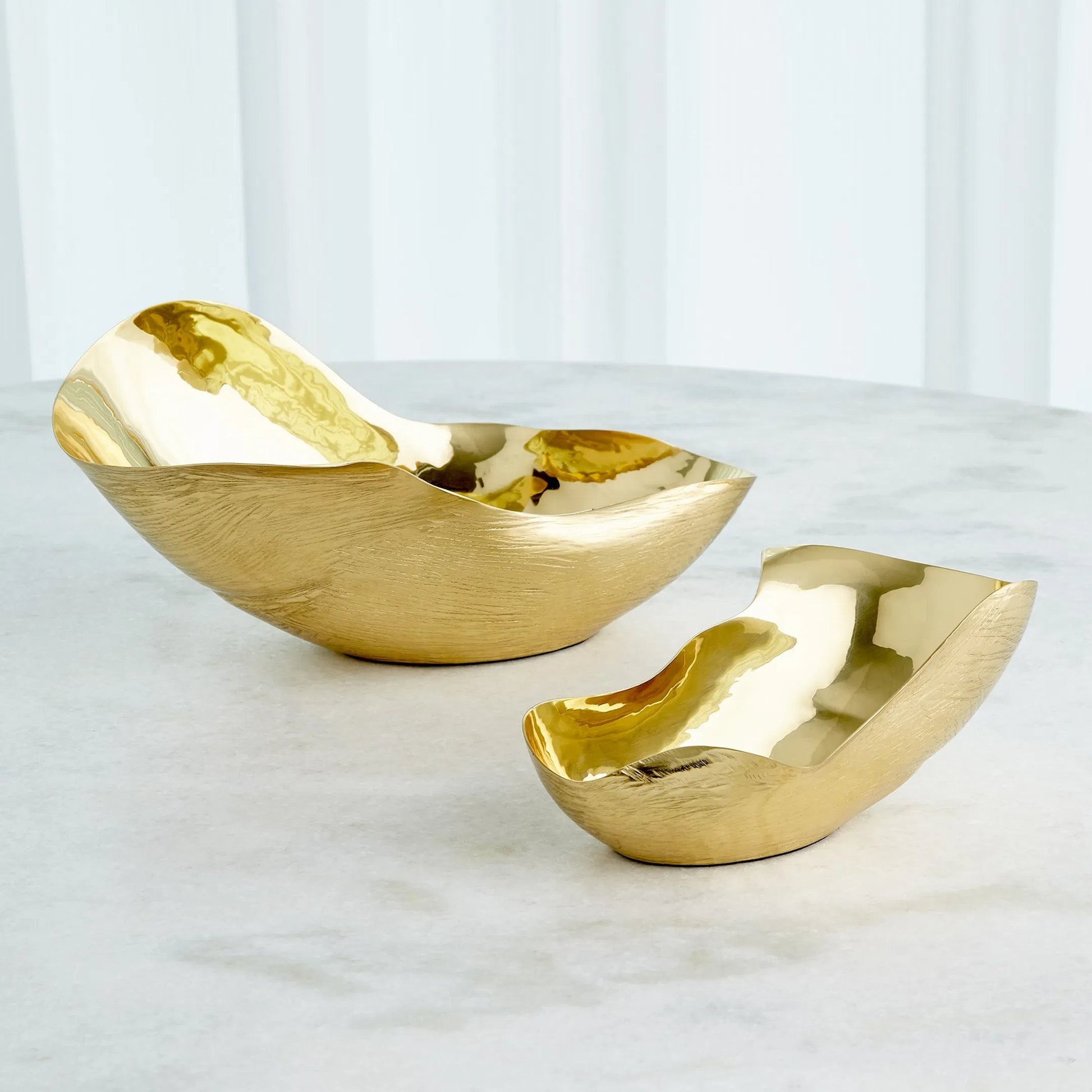 Free Form Bowl by Global Views. Made from brass in a modern style.