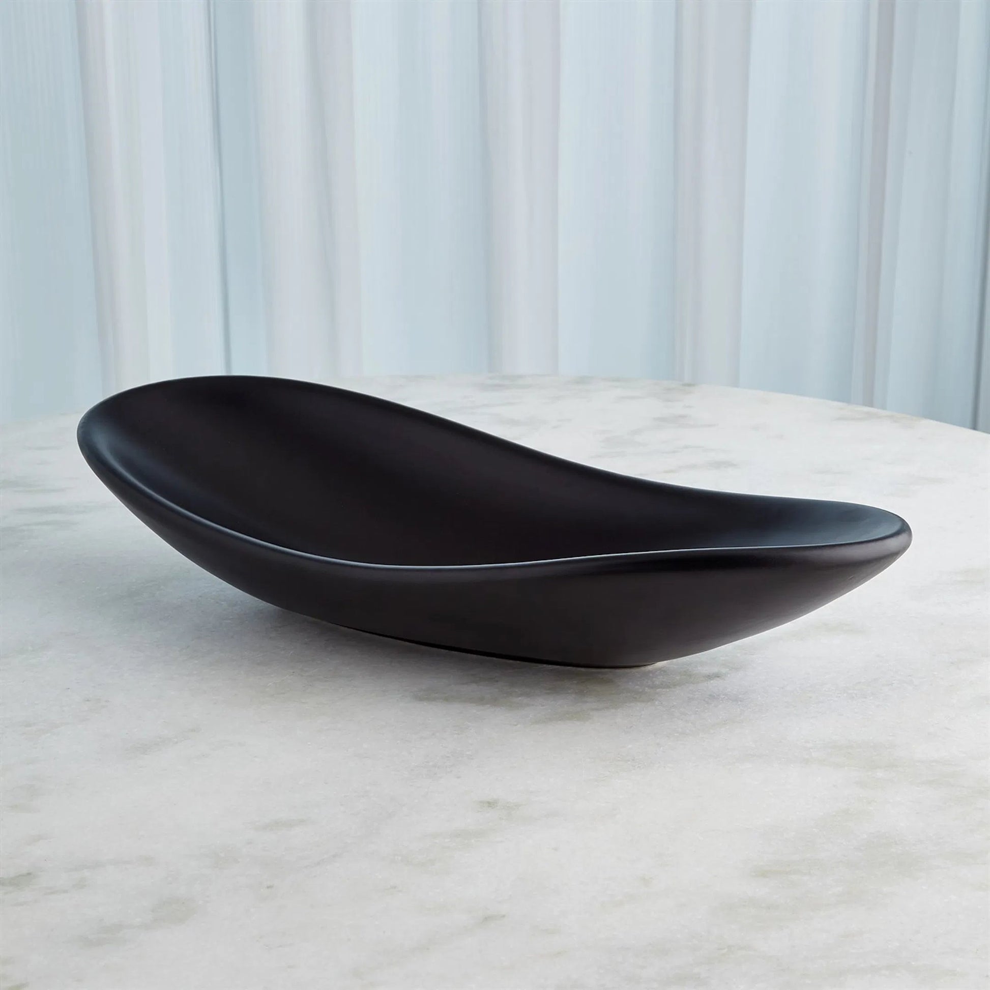 Oblong Platter Bowl by Global Views. Made from ceramic in a modern style.