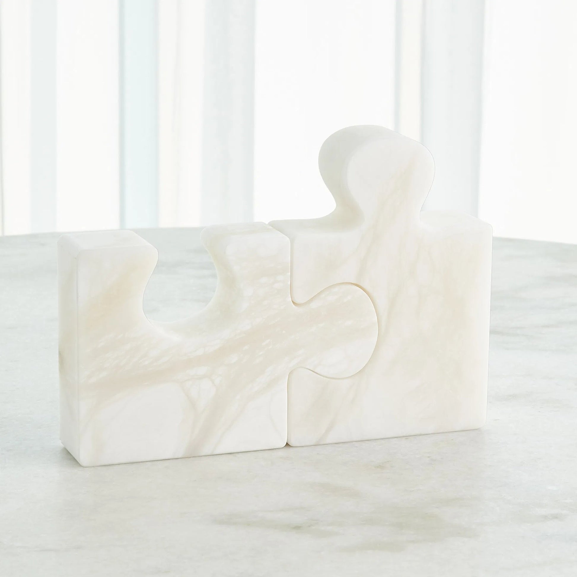 Alabaster Jigsaw Bookends by Global Views. Made from alabaster in a eclectic & global style.