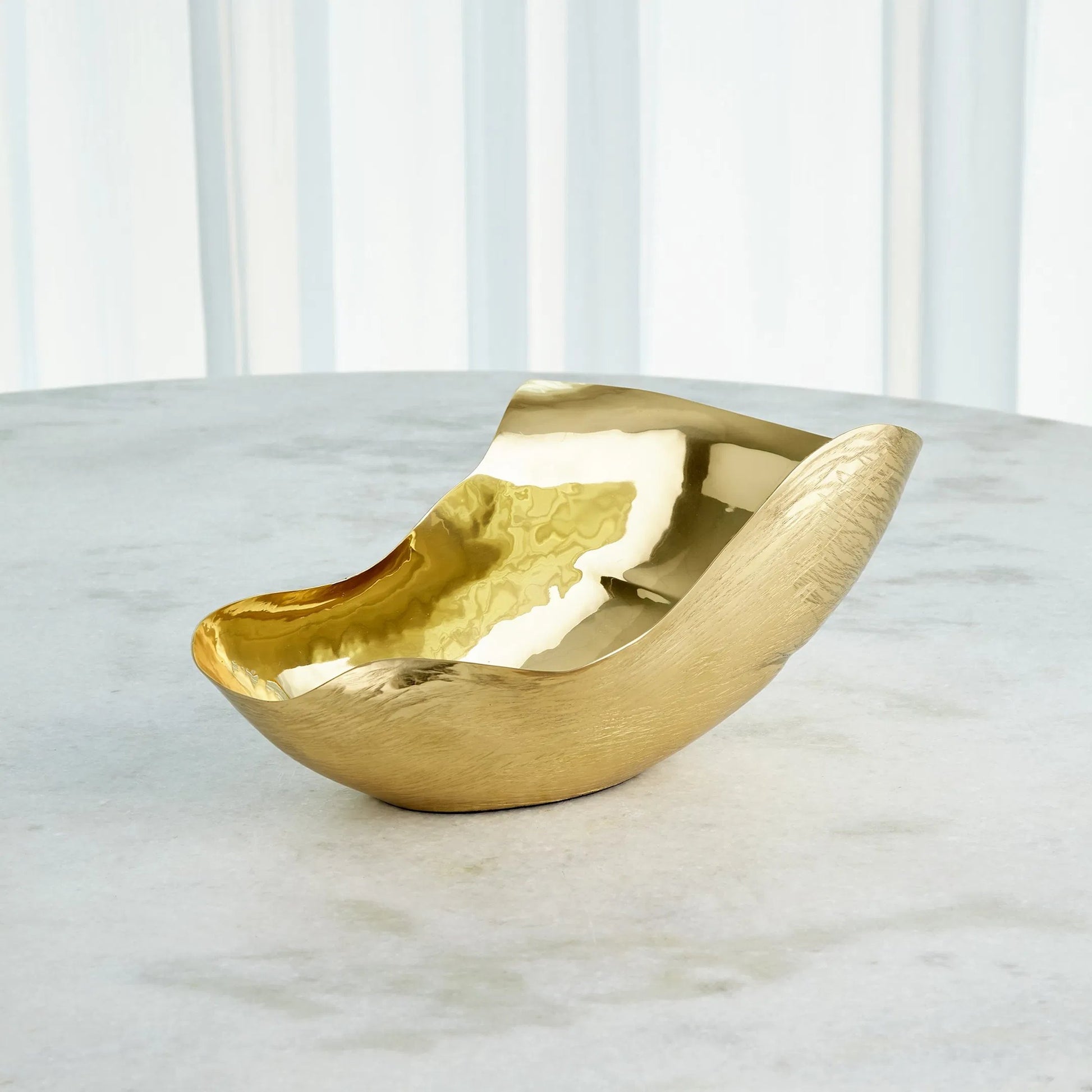 Free Form Bowl by Global Views. Made from brass in a modern style.