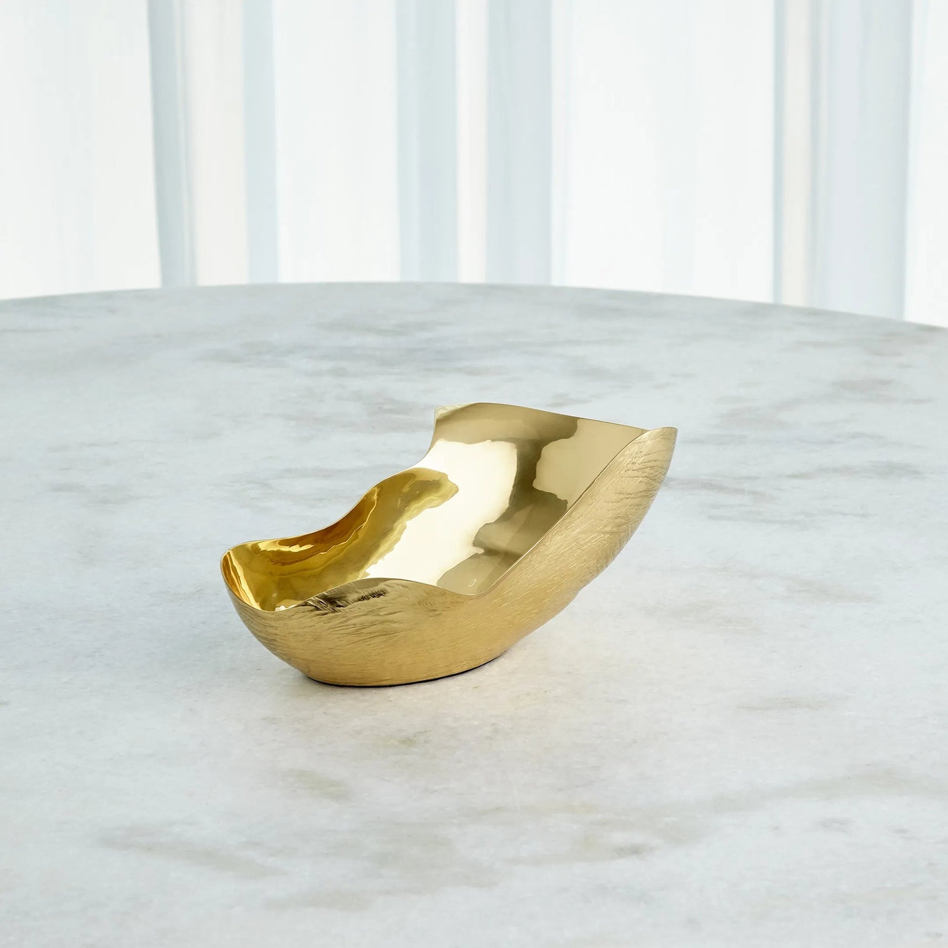 Free Form Bowl by Global Views. Made from brass in a modern style.