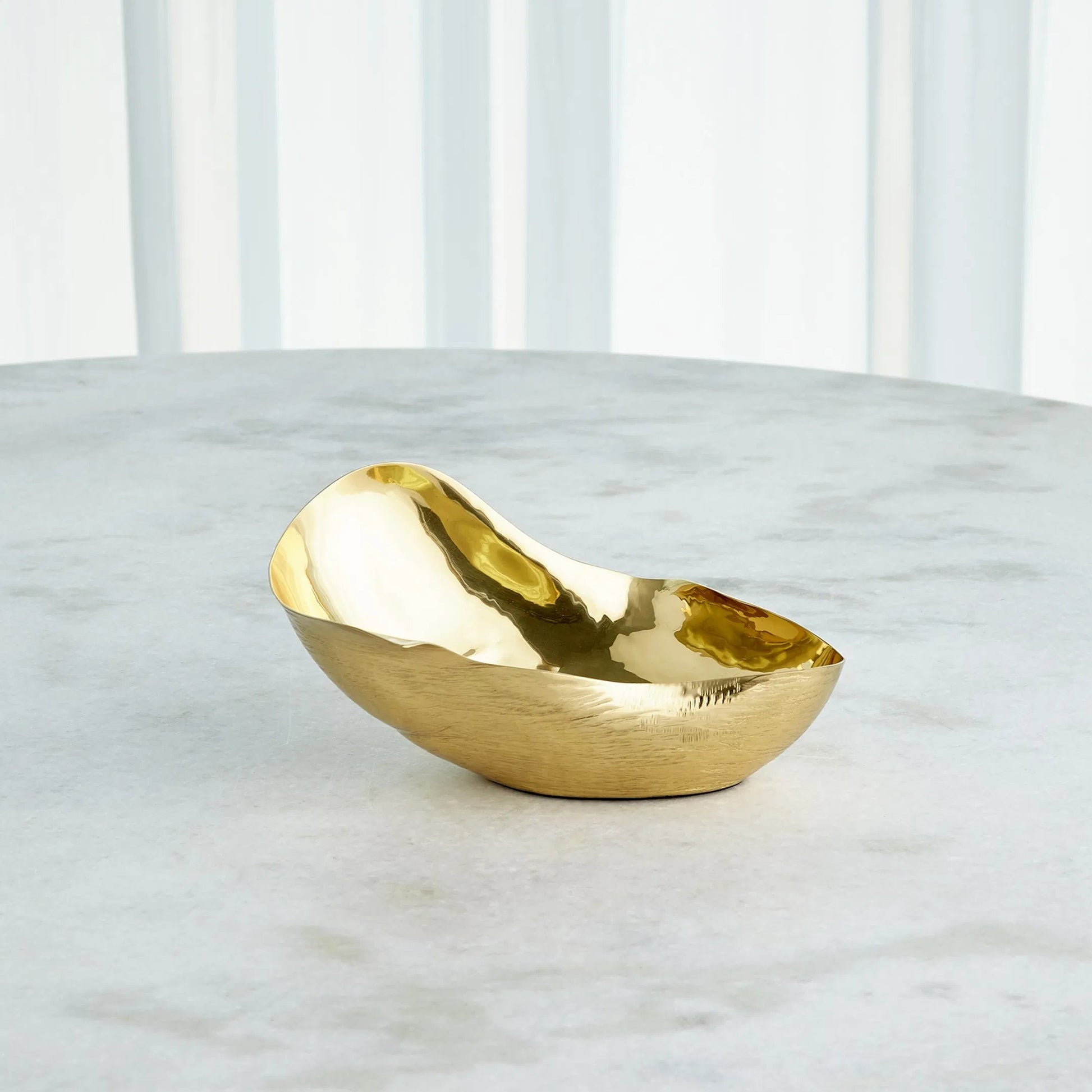 Free Form Bowl by Global Views. Made from brass in a modern style.