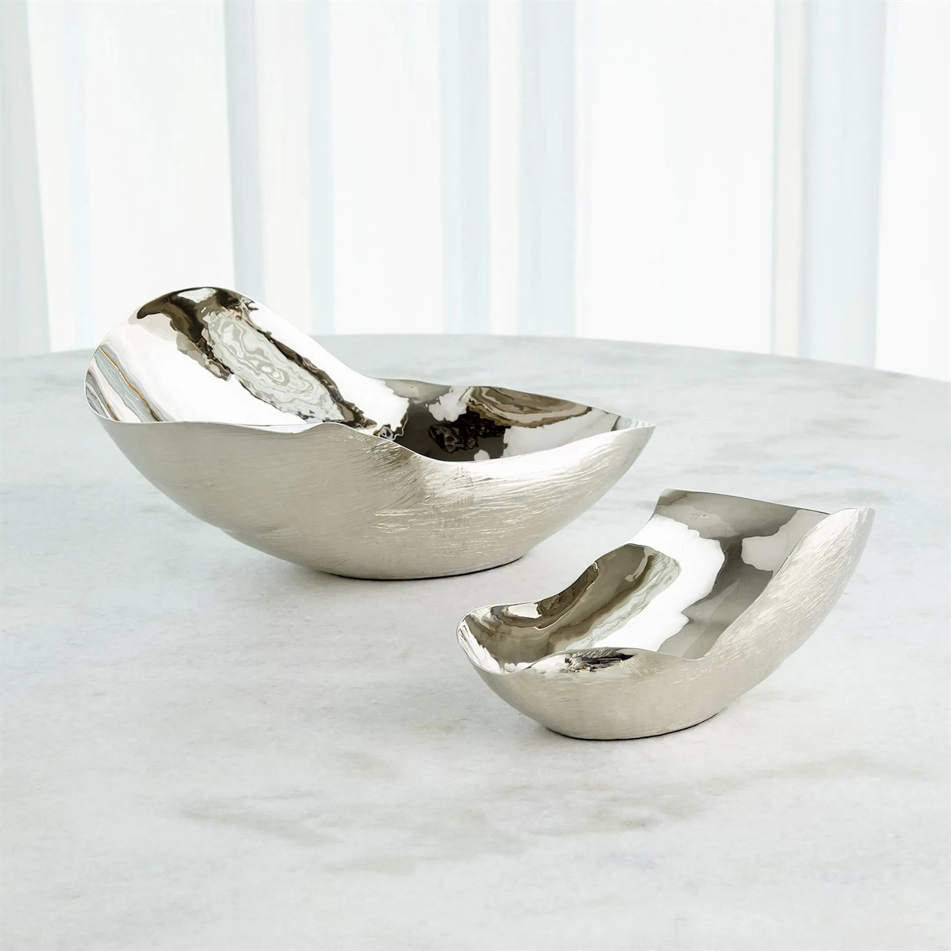 Free Form Bowl by Global Views. Made from brass in a modern style.
