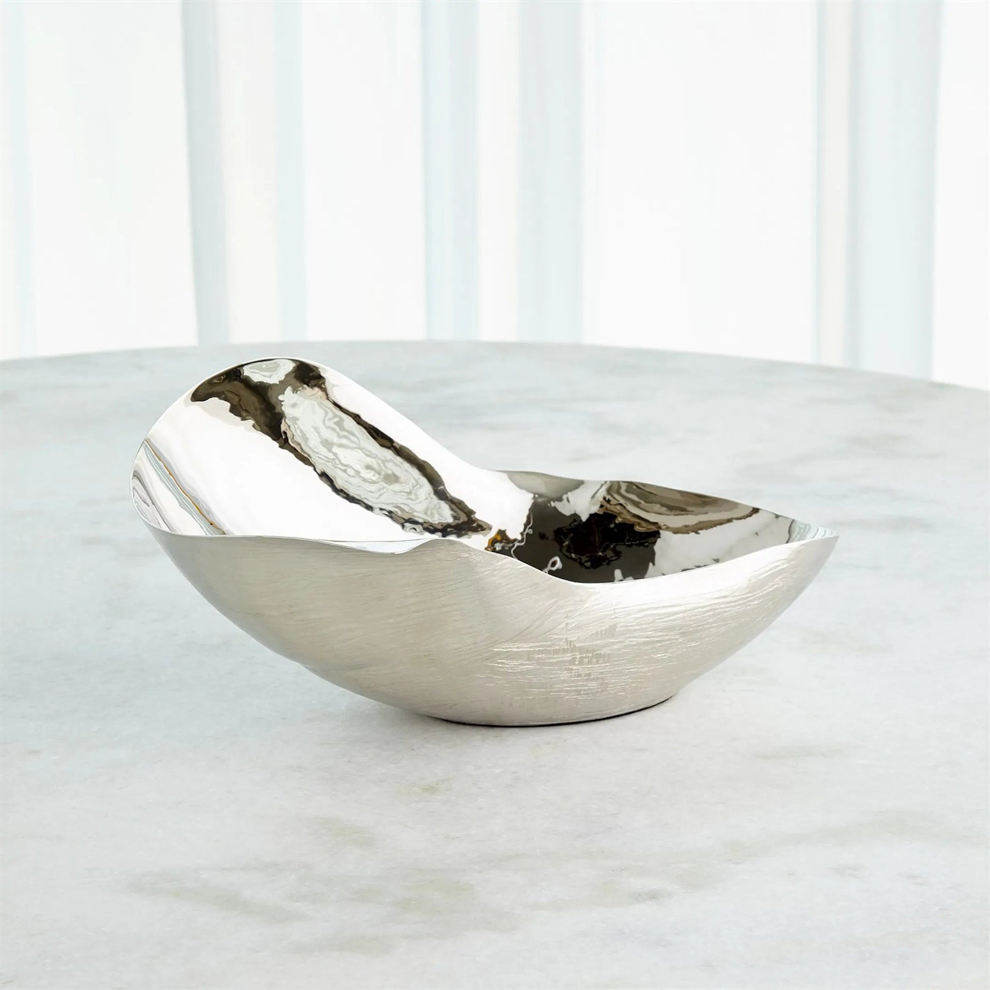 Free Form Bowl by Global Views. Made from brass in a modern style.