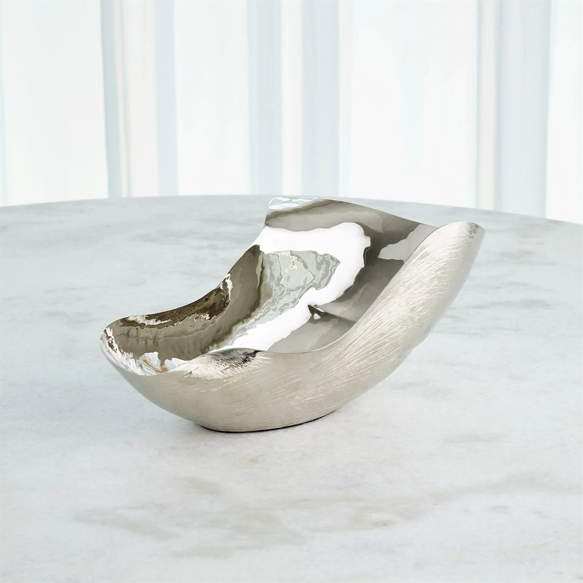 Free Form Bowl by Global Views. Made from brass in a modern style.