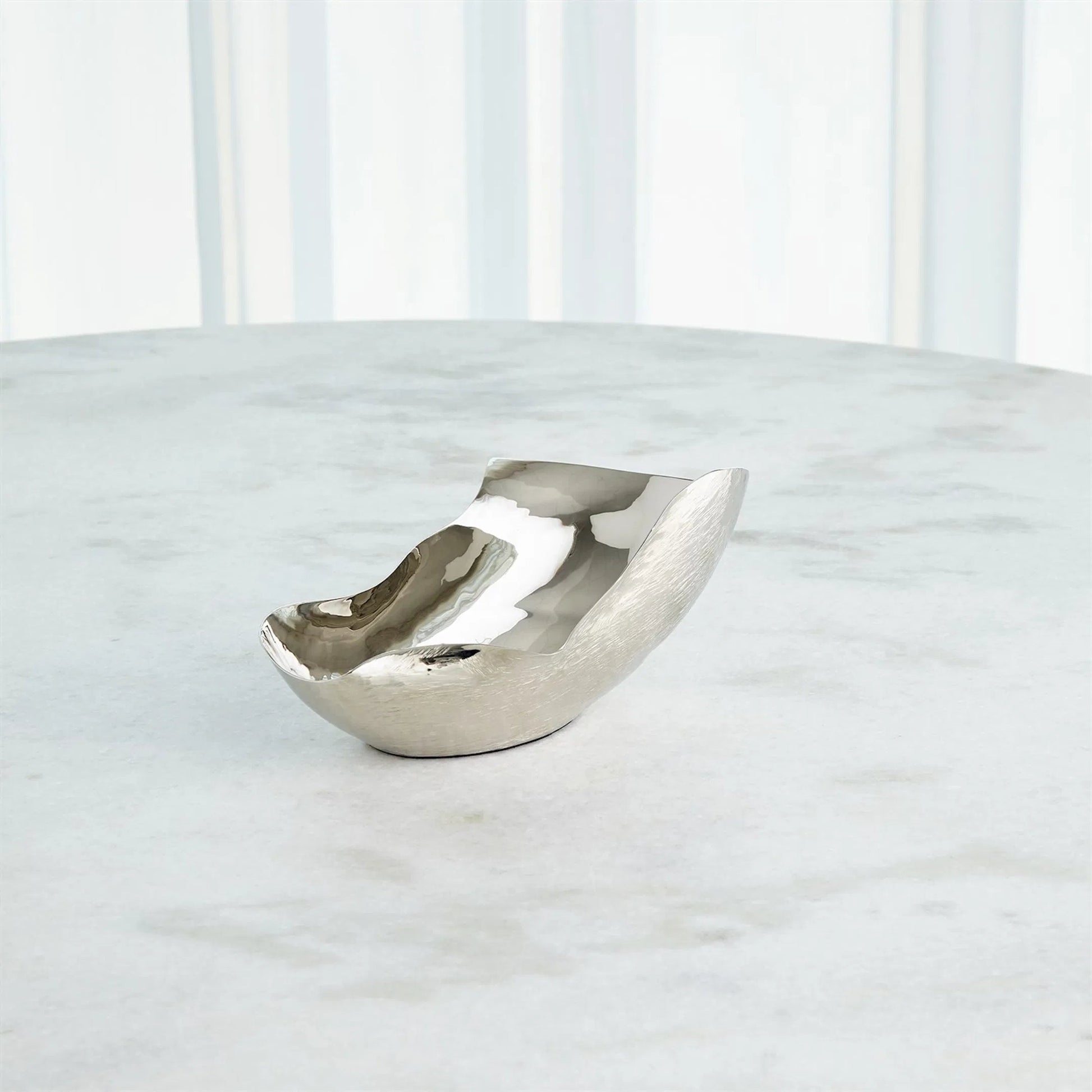 Free Form Bowl by Global Views. Made from brass in a modern style.