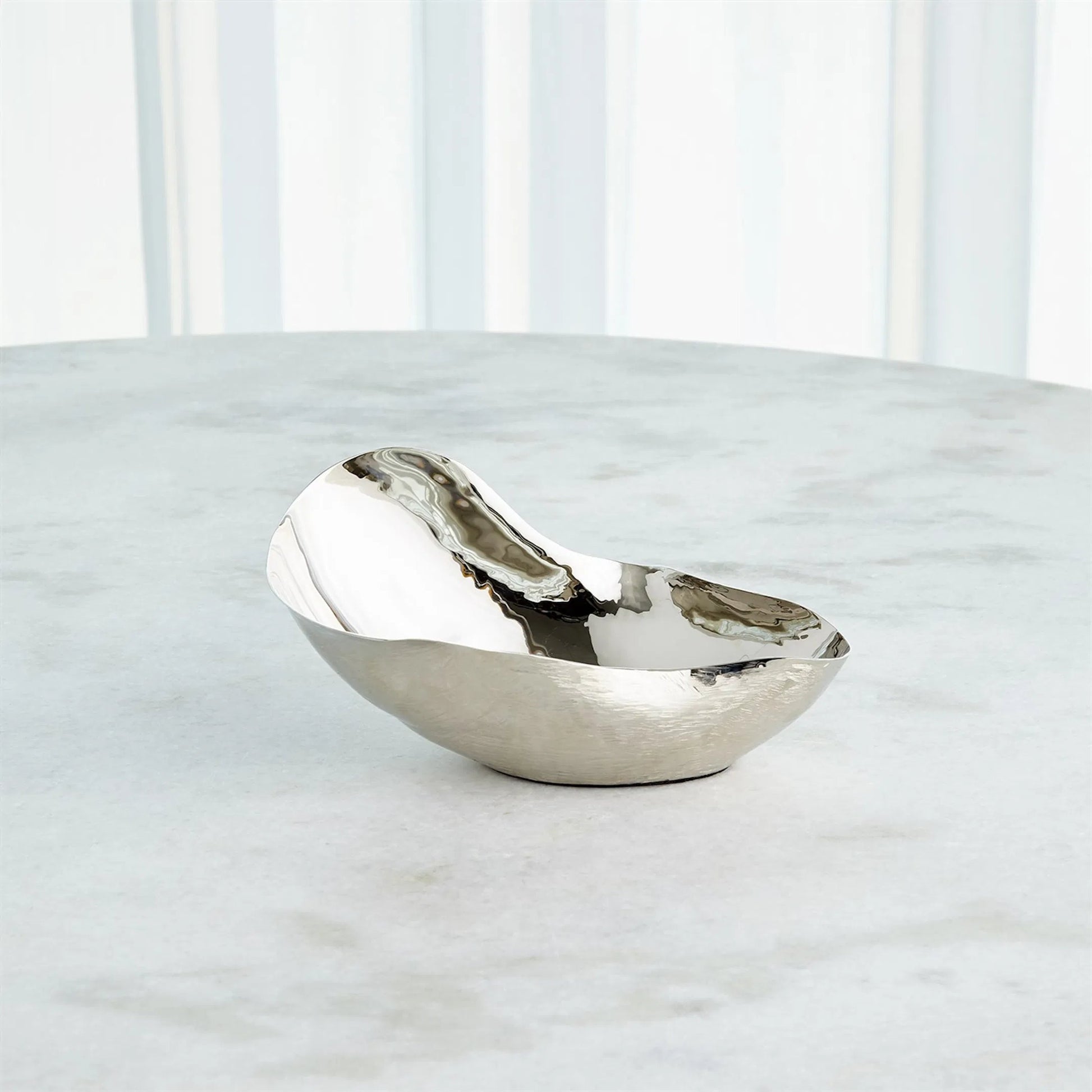 Free Form Bowl by Global Views. Made from brass in a modern style.