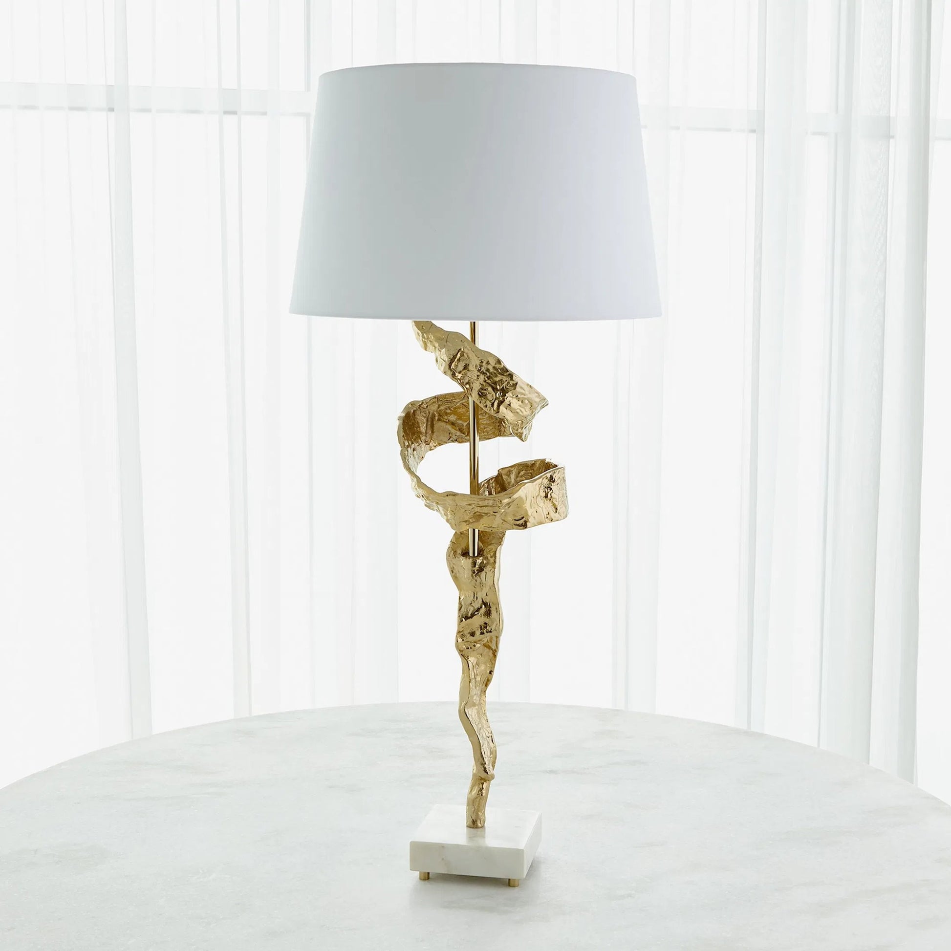 Twist Lamp by Global Views in brass. Made from brass, marble in a unique style.