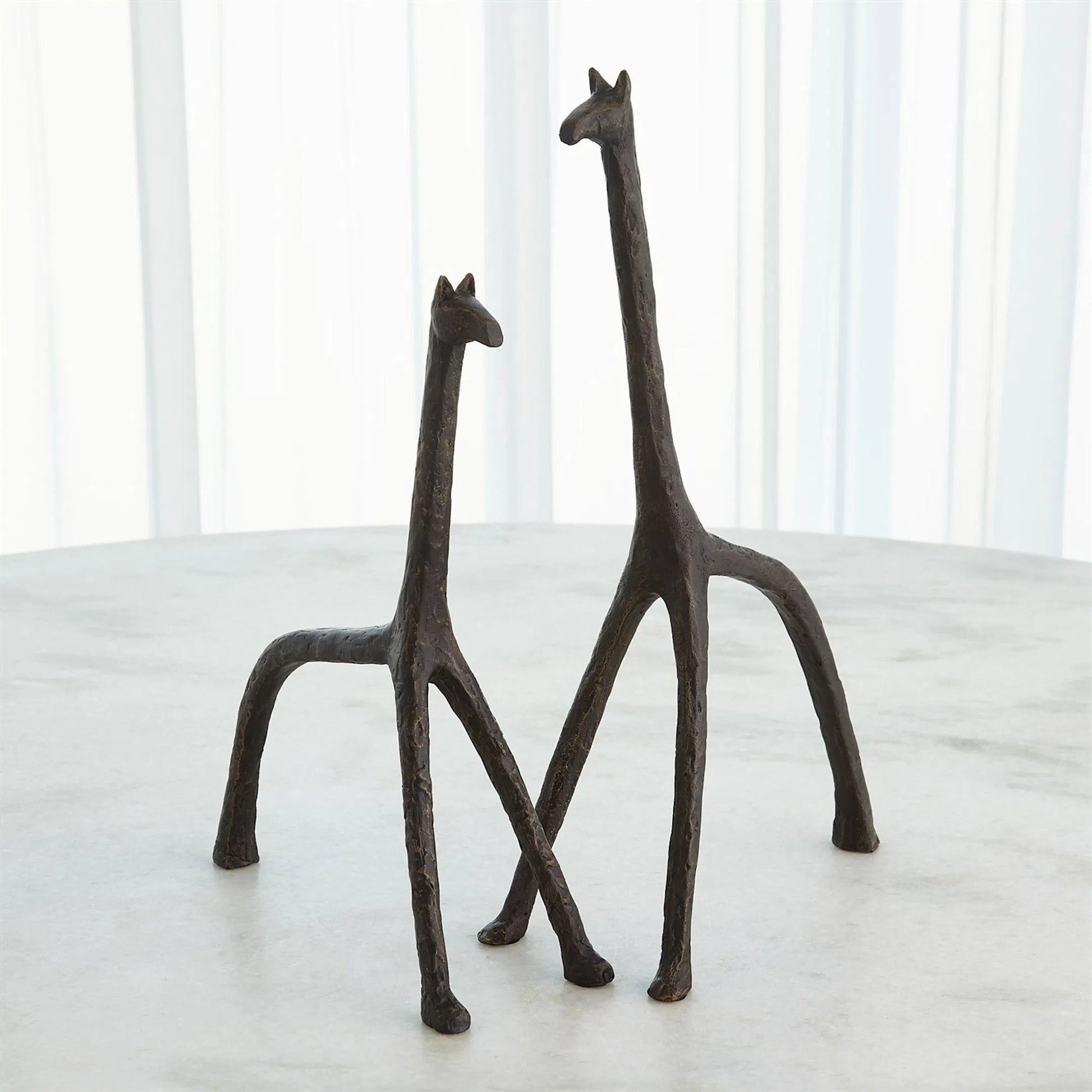 Iron Giraffe by Global Views in bronze. Made from unique in a modern style.