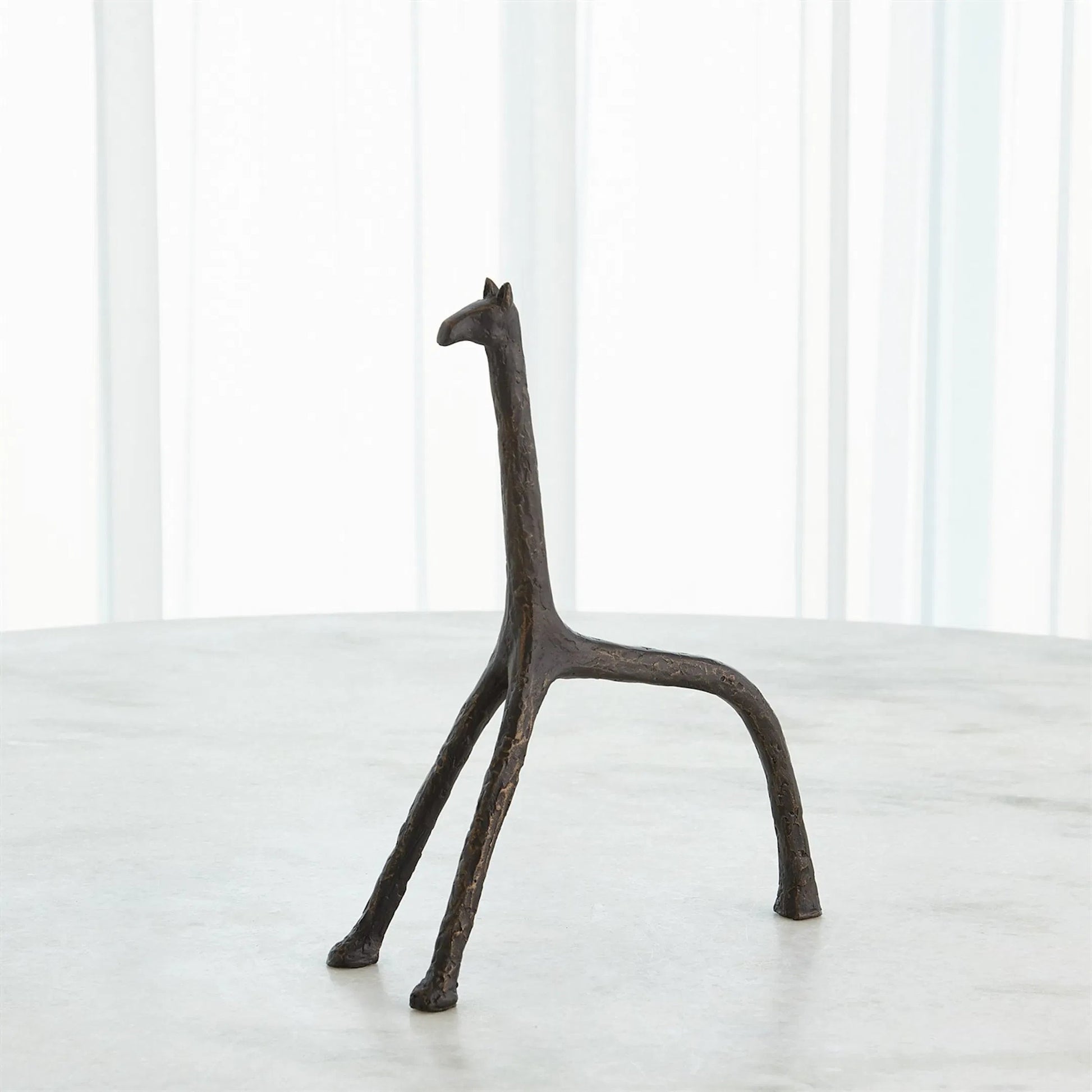 Iron Giraffe by Global Views in bronze. Made from unique in a modern style.