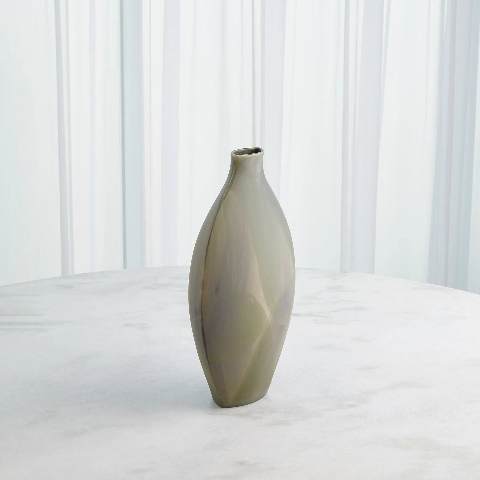 Helios Green Vase by Global Views in green. Made from unique in a unique style.