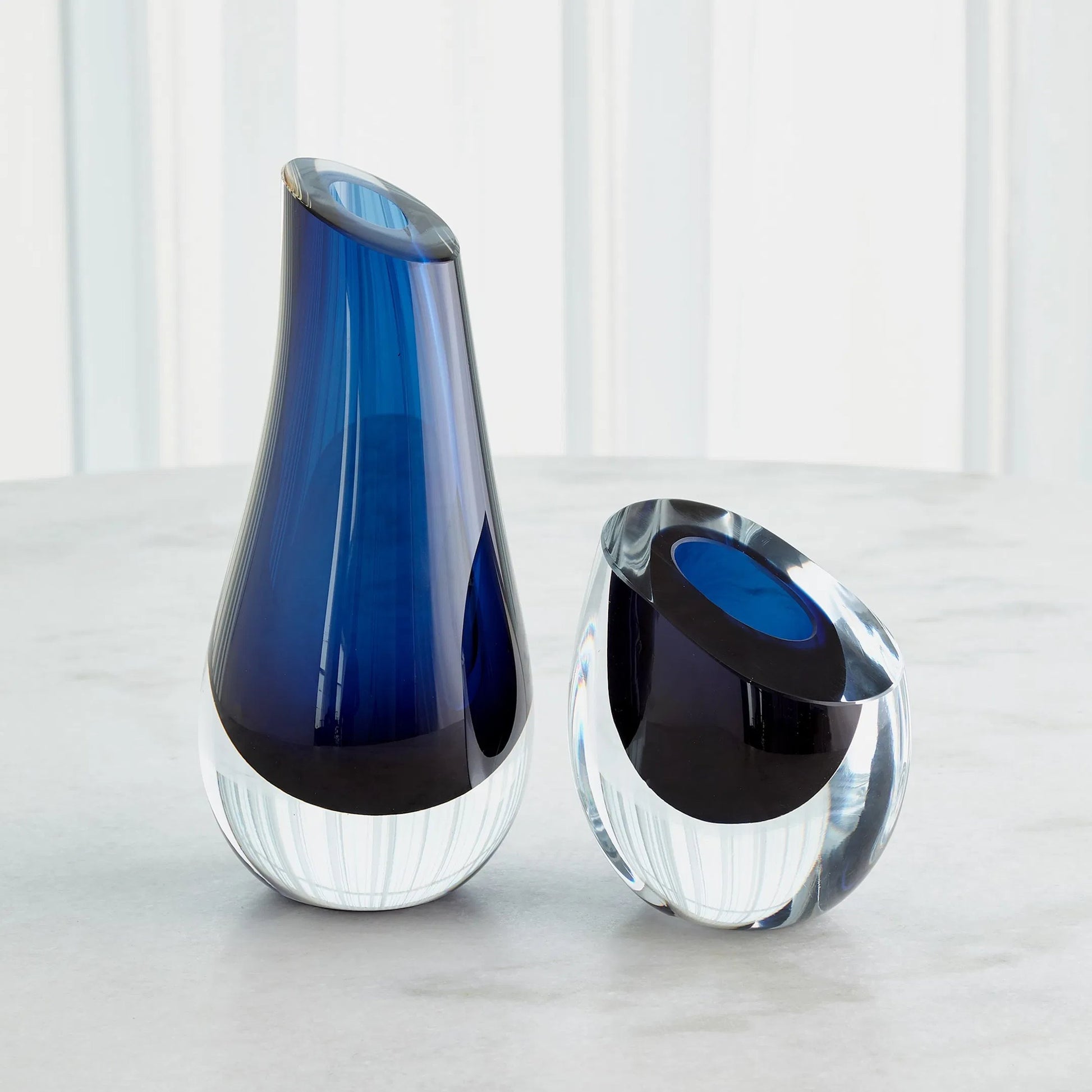 Slant Vase by Global Views. Made from art glass in a modern style.