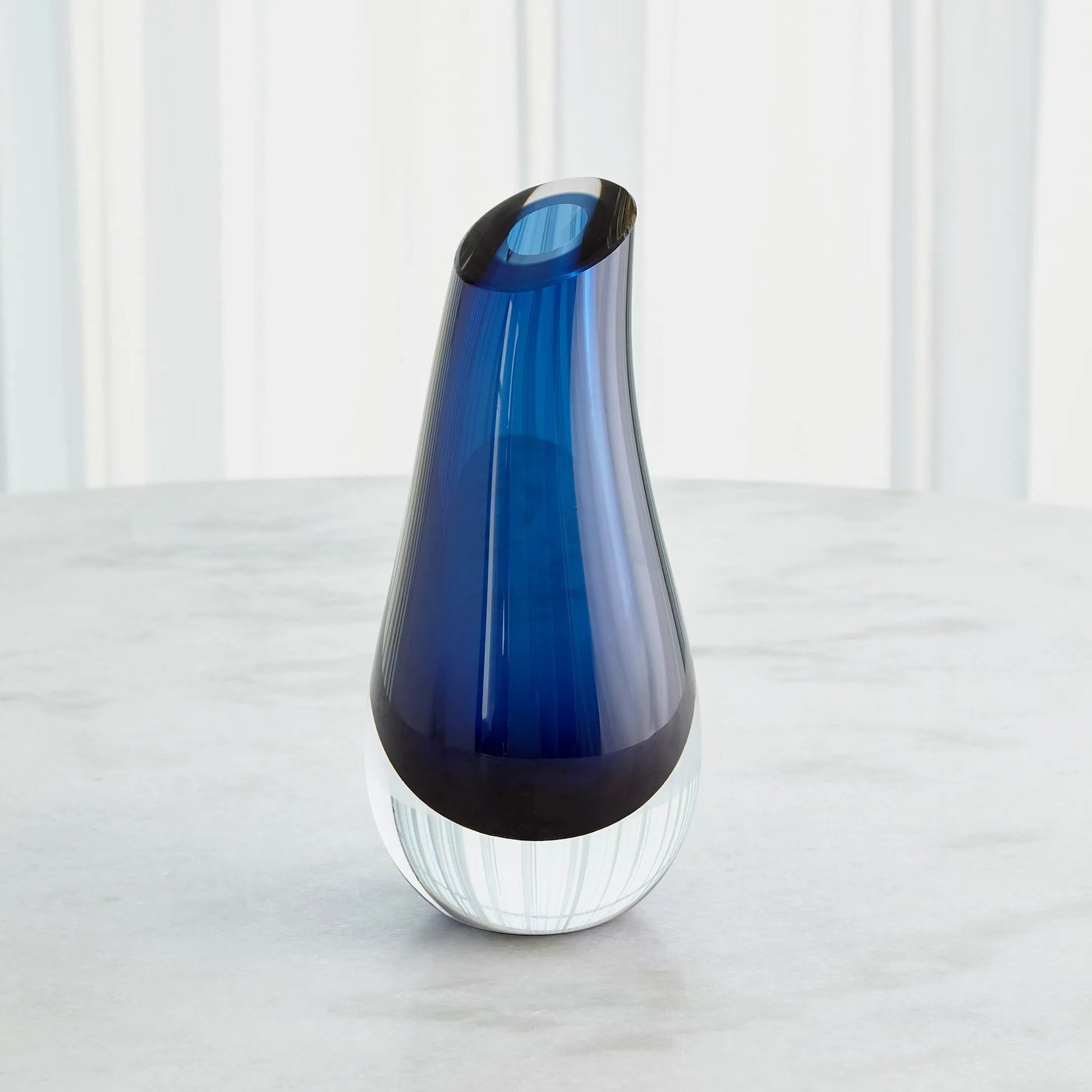 Slant Vase by Global Views. Made from art glass in a modern style.