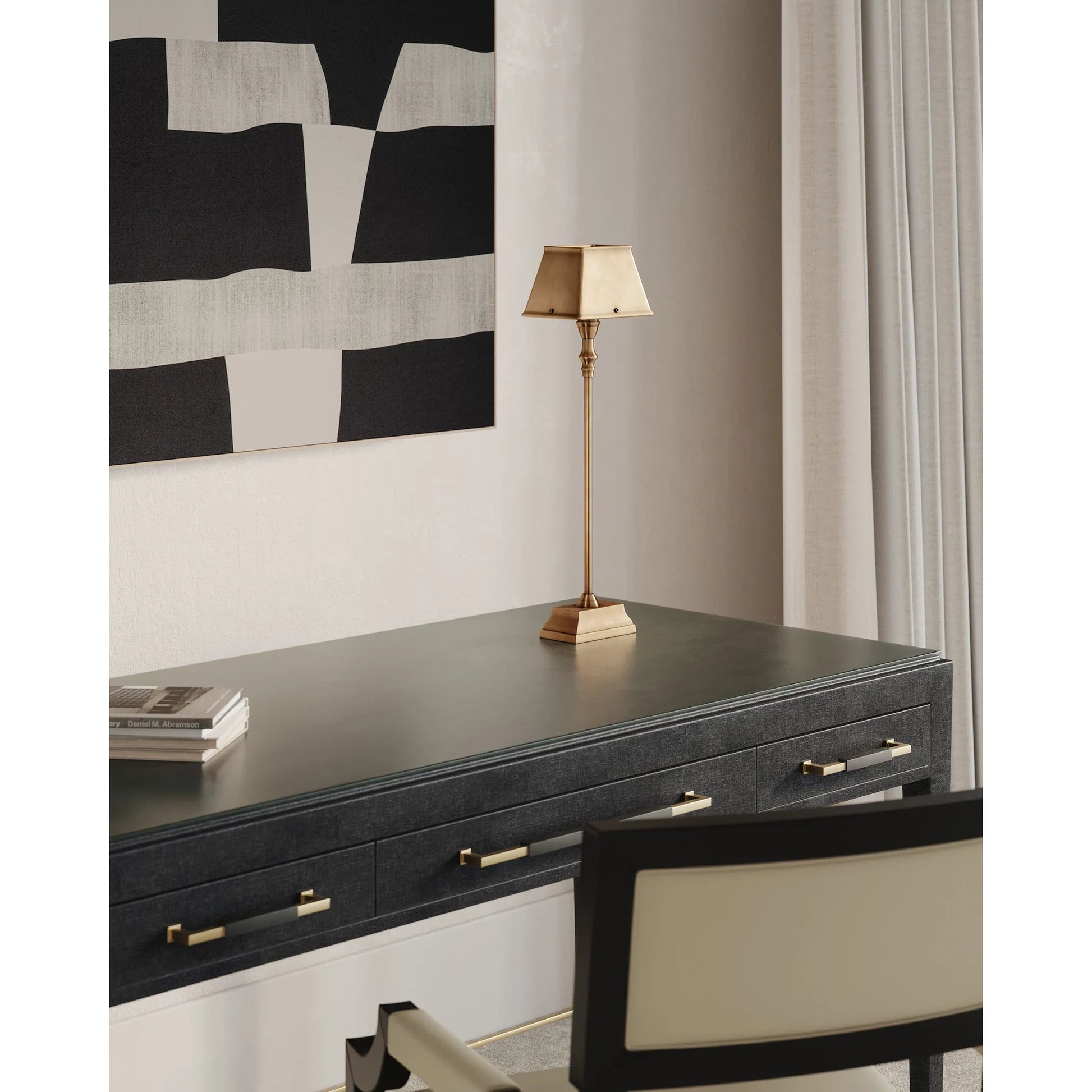Geddy Table Lamp by Currey and Company in antique brass. Made from brass in a modern style.