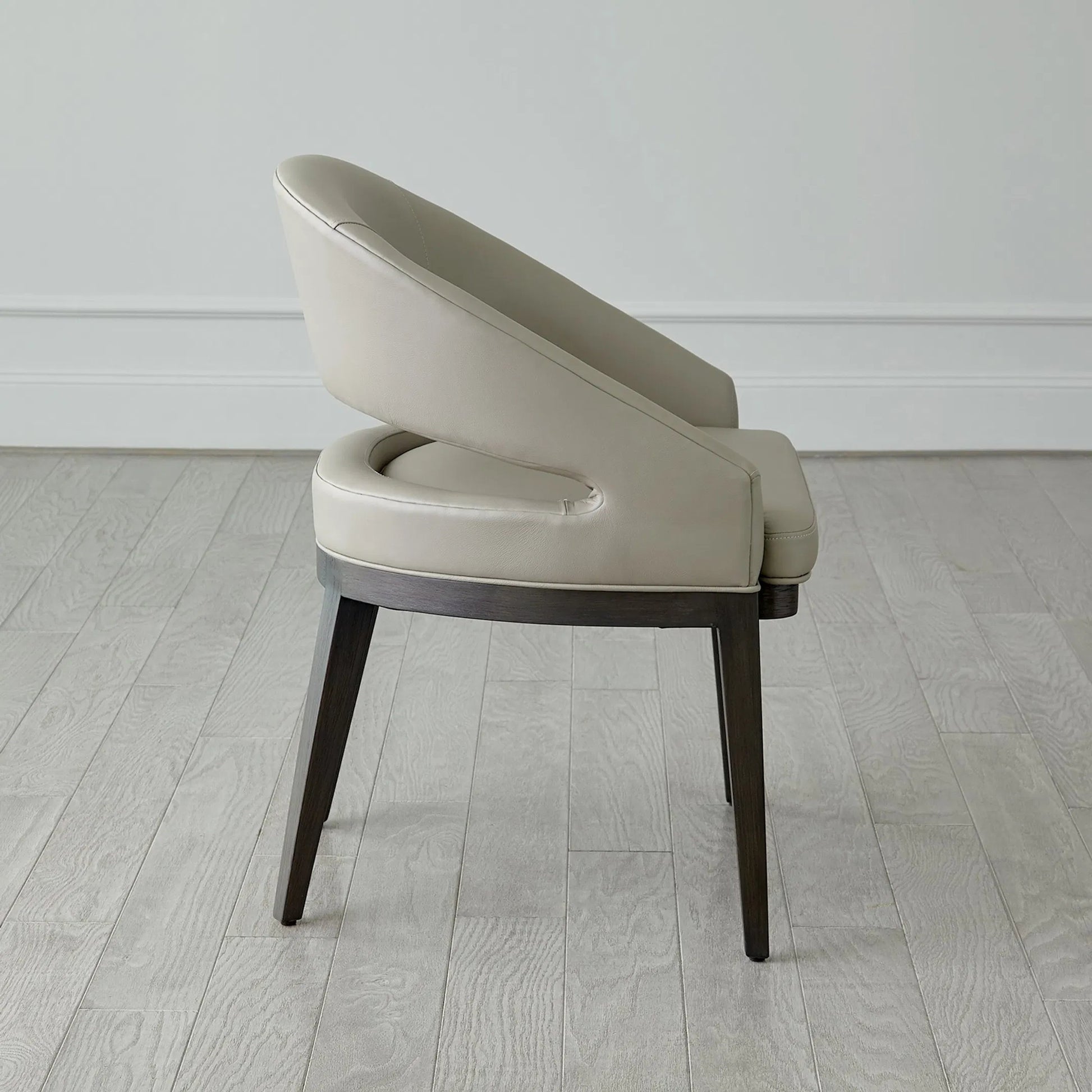Alcott Dining Chair by Global Views. Made from beech wood, semi-aniline grey leather in a transitional style.