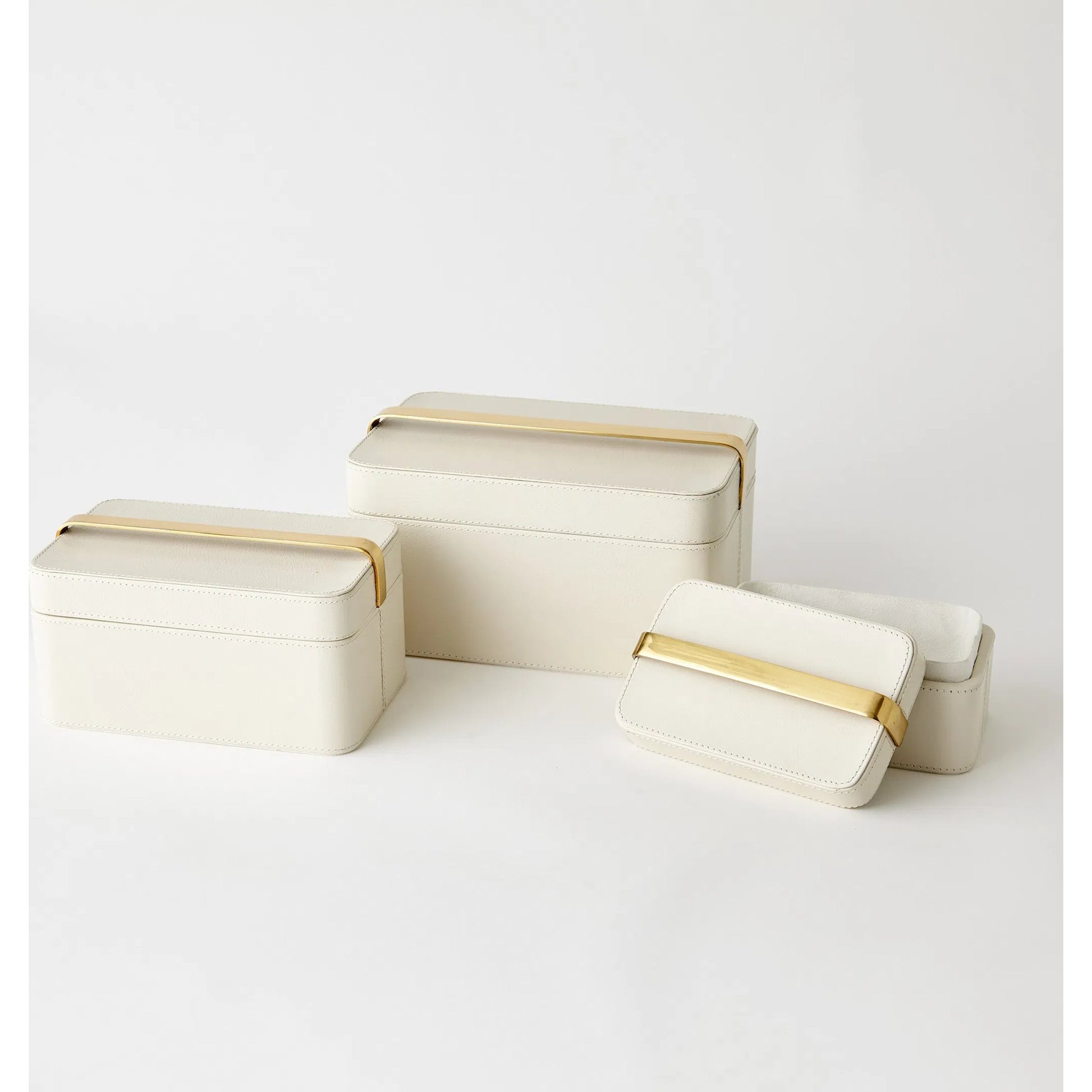 Avery Decorative Box by Global Views in milk. Made from mdf, vegetable tanned leather, polysuede lining, brass in a modern style.