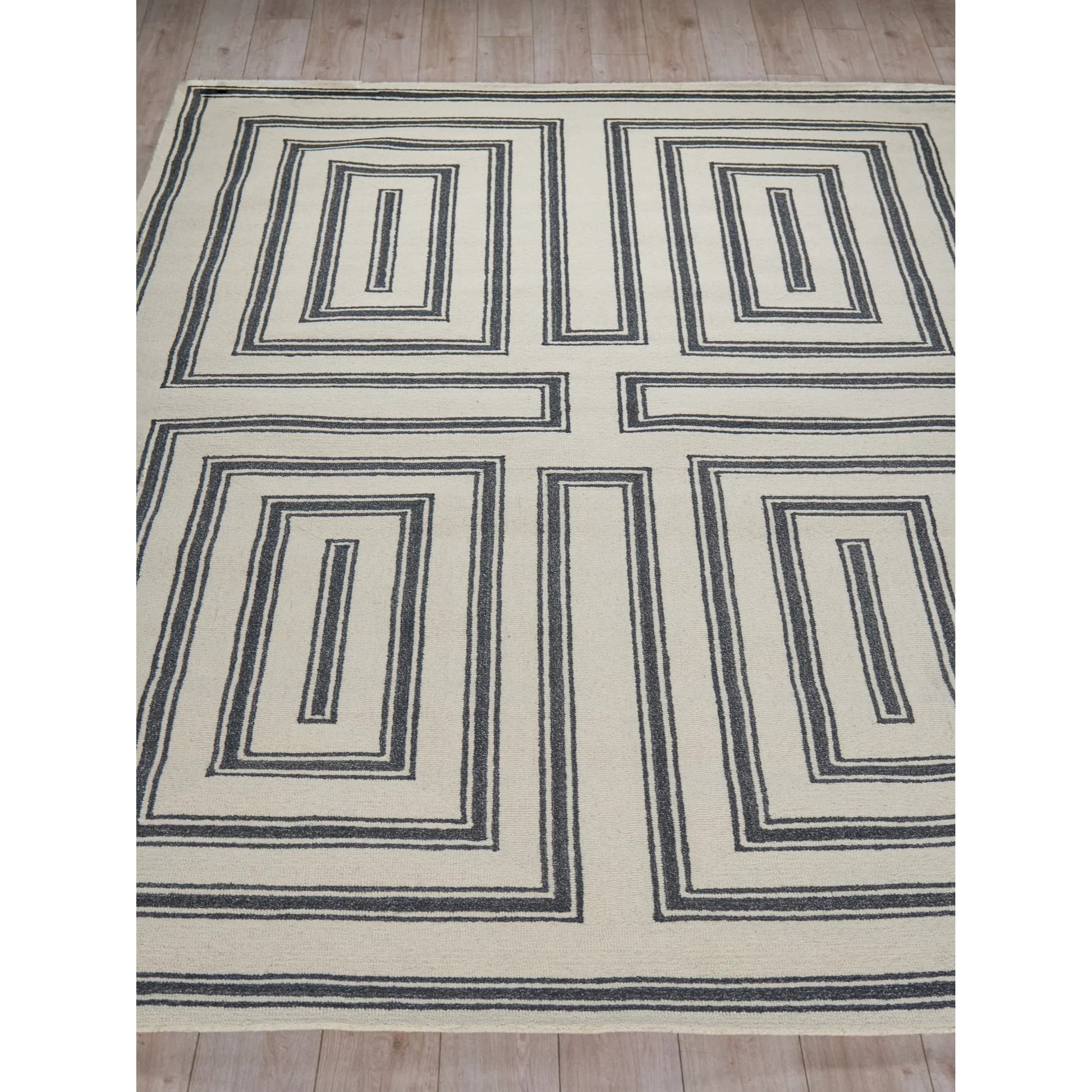 Studio 7531 Rug by Exquisite Rugs in ivory, black. Made from new zealand wool in a unique style.