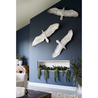 Soaring Eagle Wall Art by Phillips Collection in silver and silver leaf. Made from resin in a eclectic & global style.