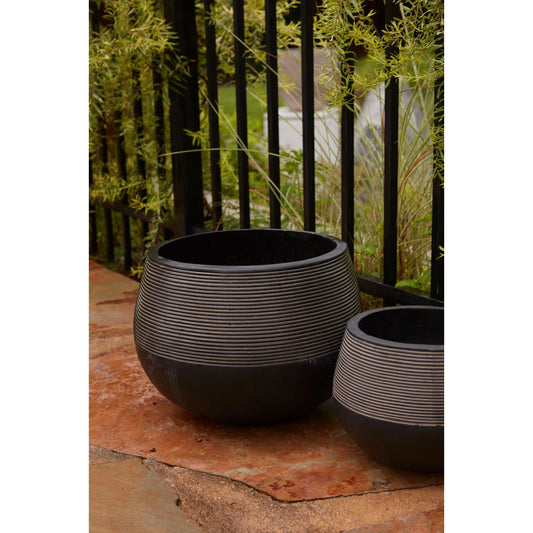 Revolution Planter by Accent Decor in black. Made from concrete in a modern style.