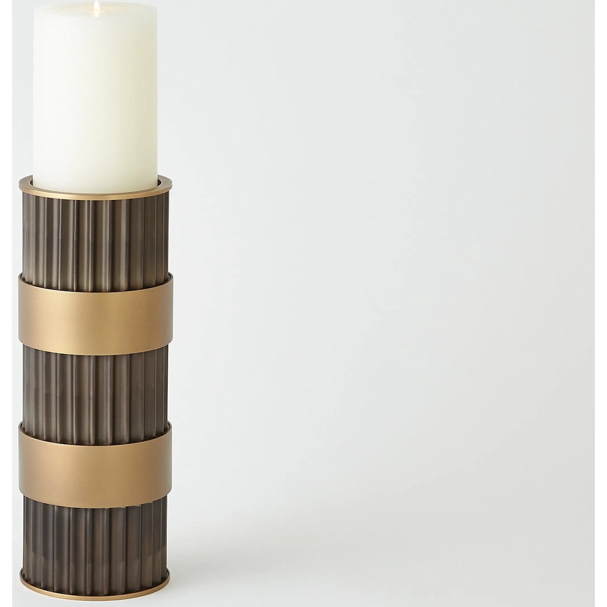 Magic Flute Cylinder Candleholder by Global Views in bronze. Made from unique in a modern style.