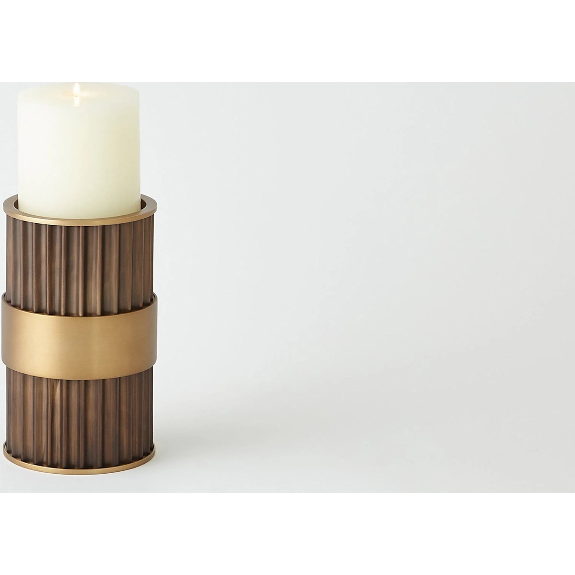 Magic Flute Cylinder Candleholder by Global Views in bronze. Made from unique in a modern style.