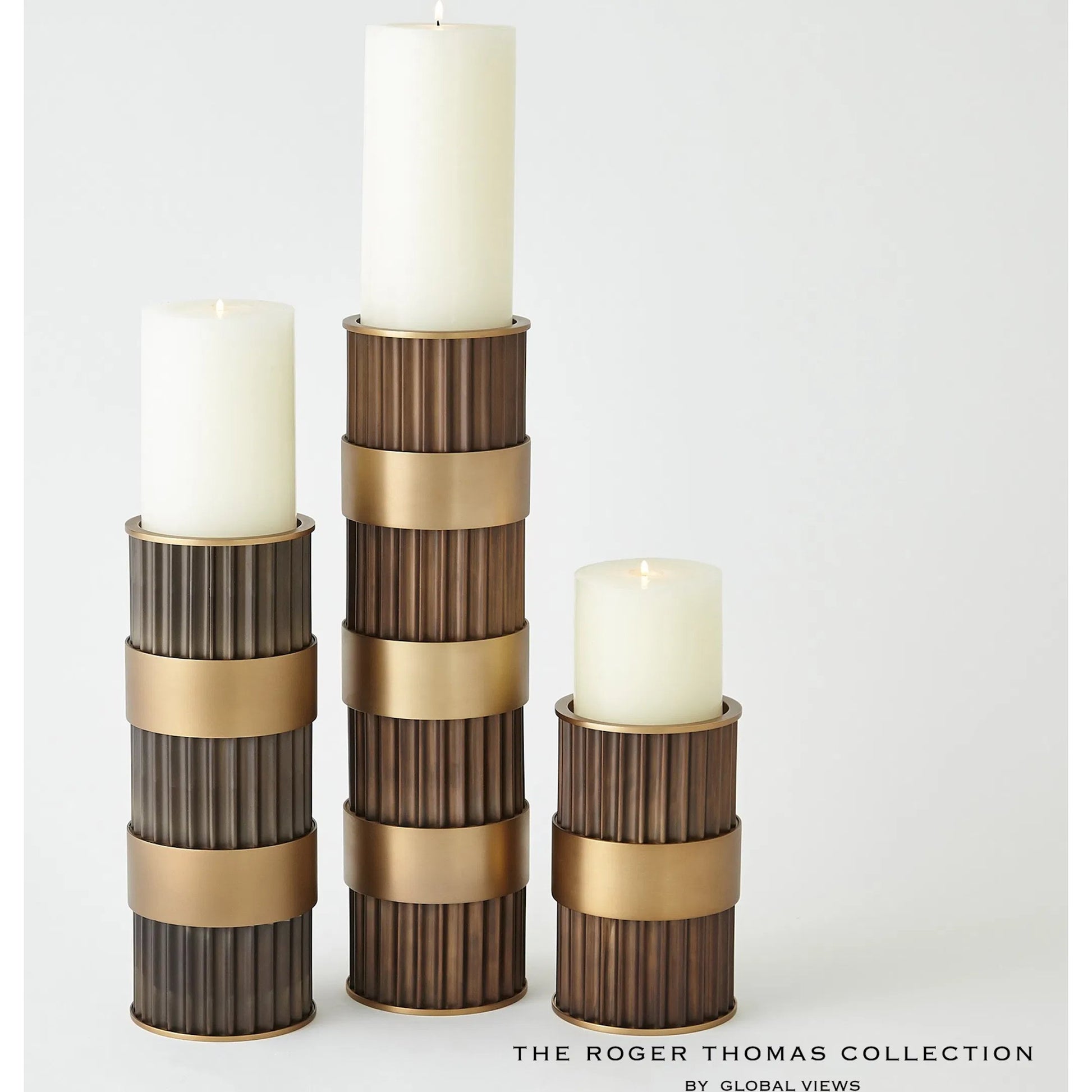 Magic Flute Cylinder Candleholder by Global Views in bronze. Made from unique in a modern style.