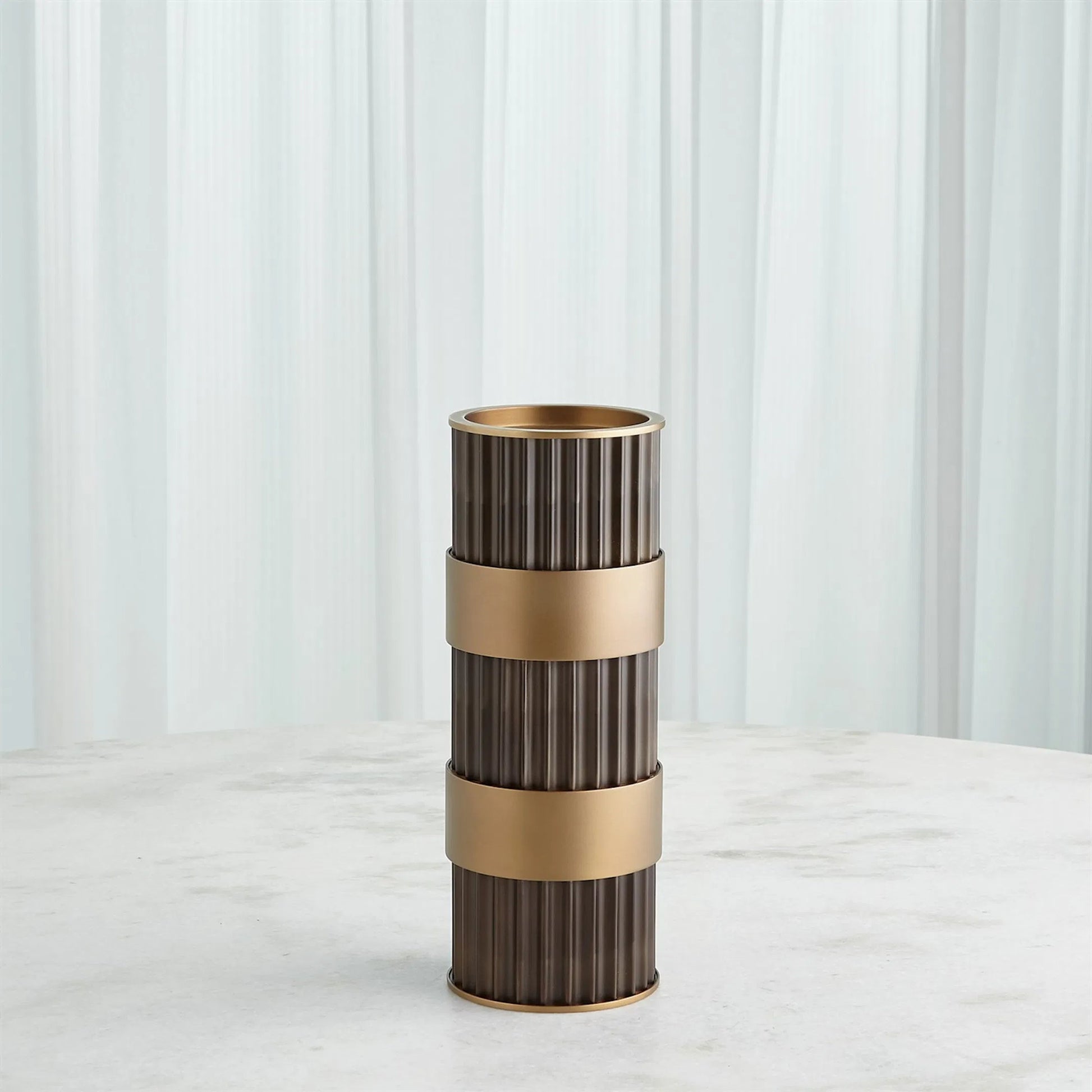 Magic Flute Cylinder Candleholder by Global Views in bronze. Made from unique in a modern style.