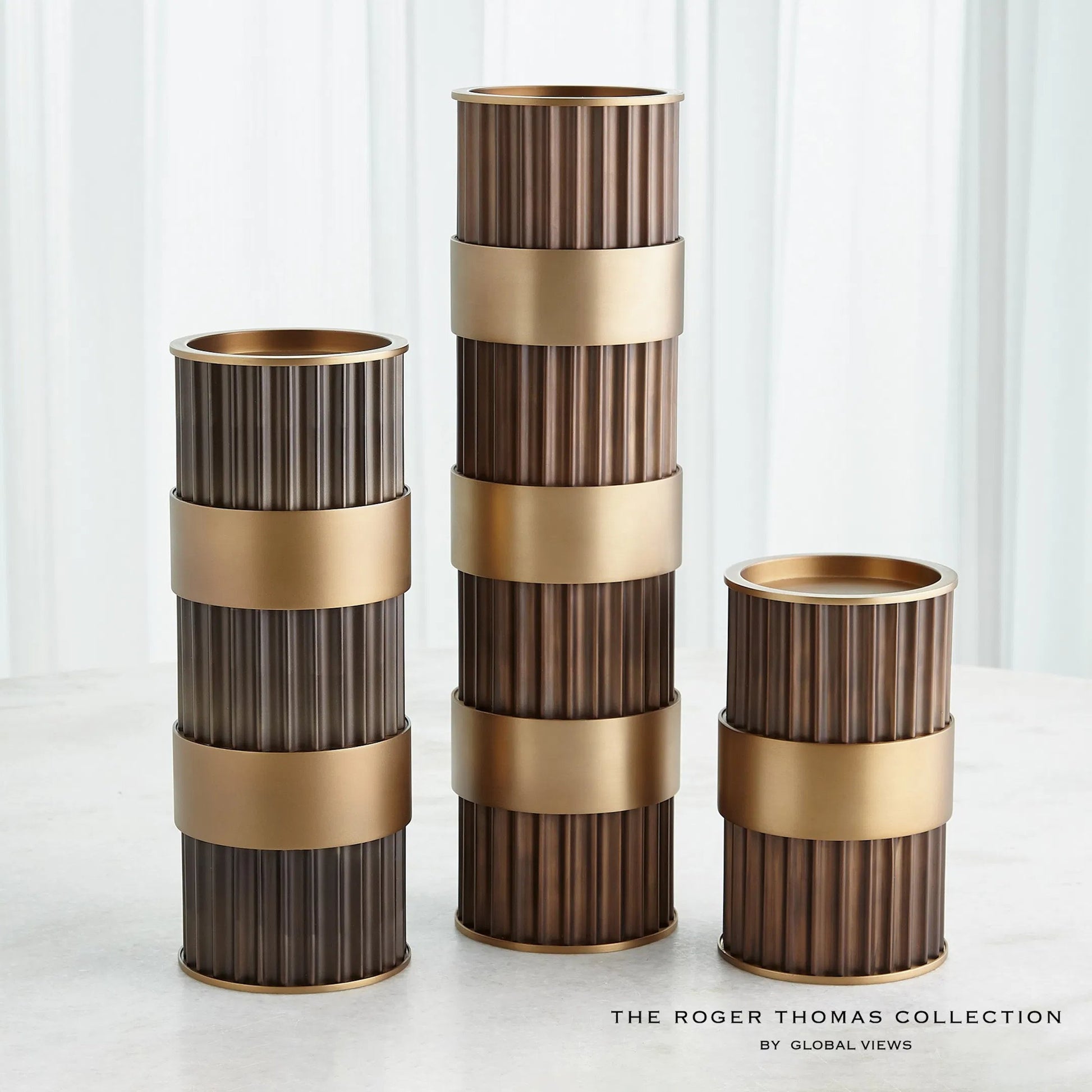 Magic Flute Cylinder Candleholder by Global Views in bronze. Made from unique in a modern style.