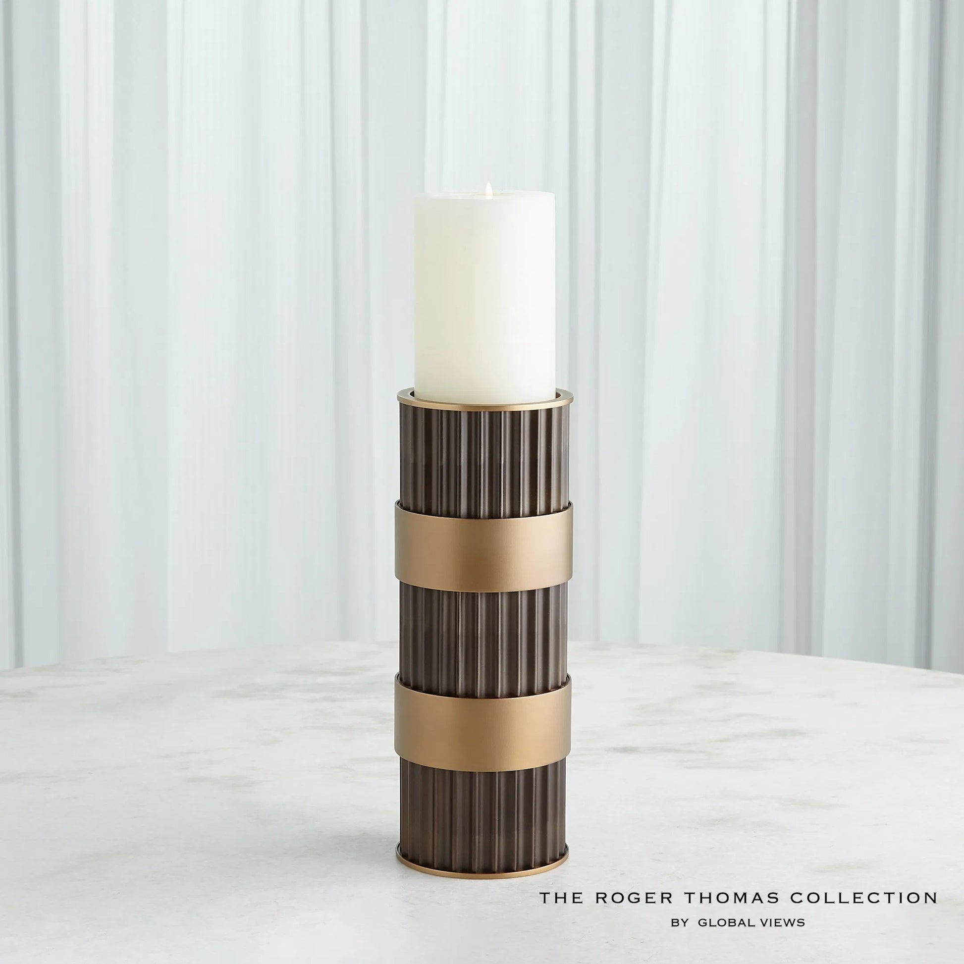 Magic Flute Cylinder Candleholder by Global Views in bronze. Made from unique in a modern style.