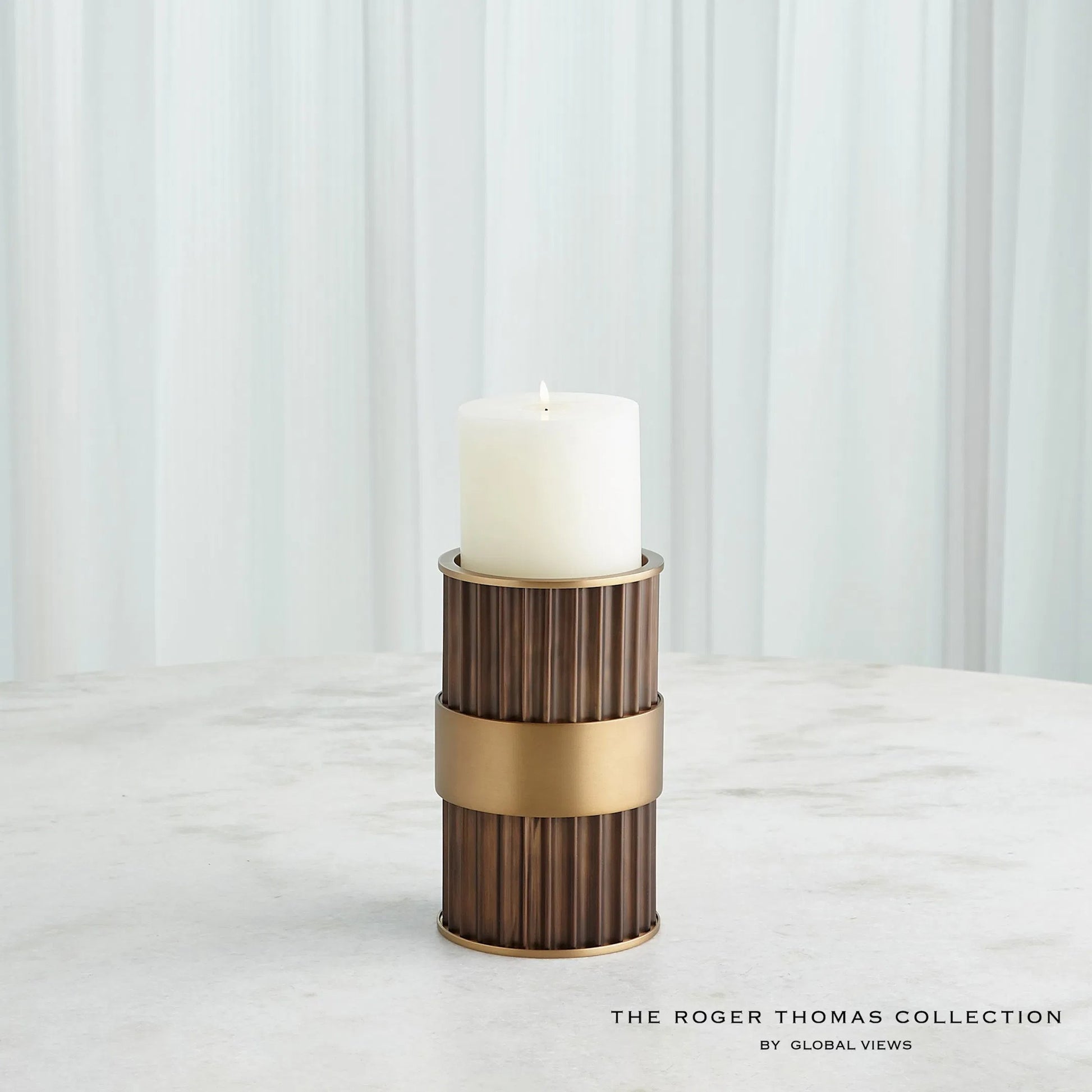 Magic Flute Cylinder Candleholder by Global Views in bronze. Made from unique in a modern style.