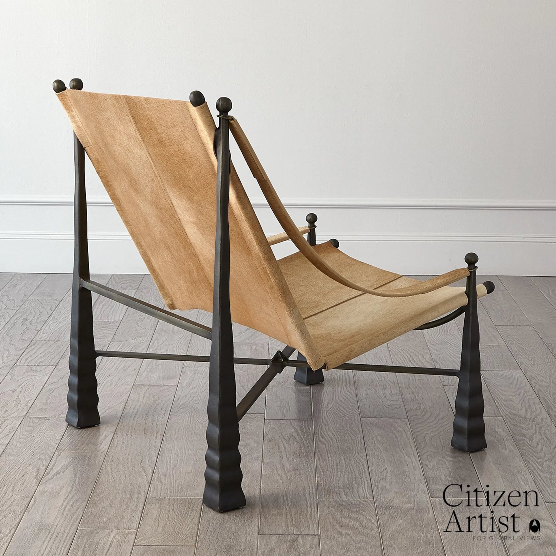 Cognac Chair by Global Views. Made from metal, cowhide in a rustic style.