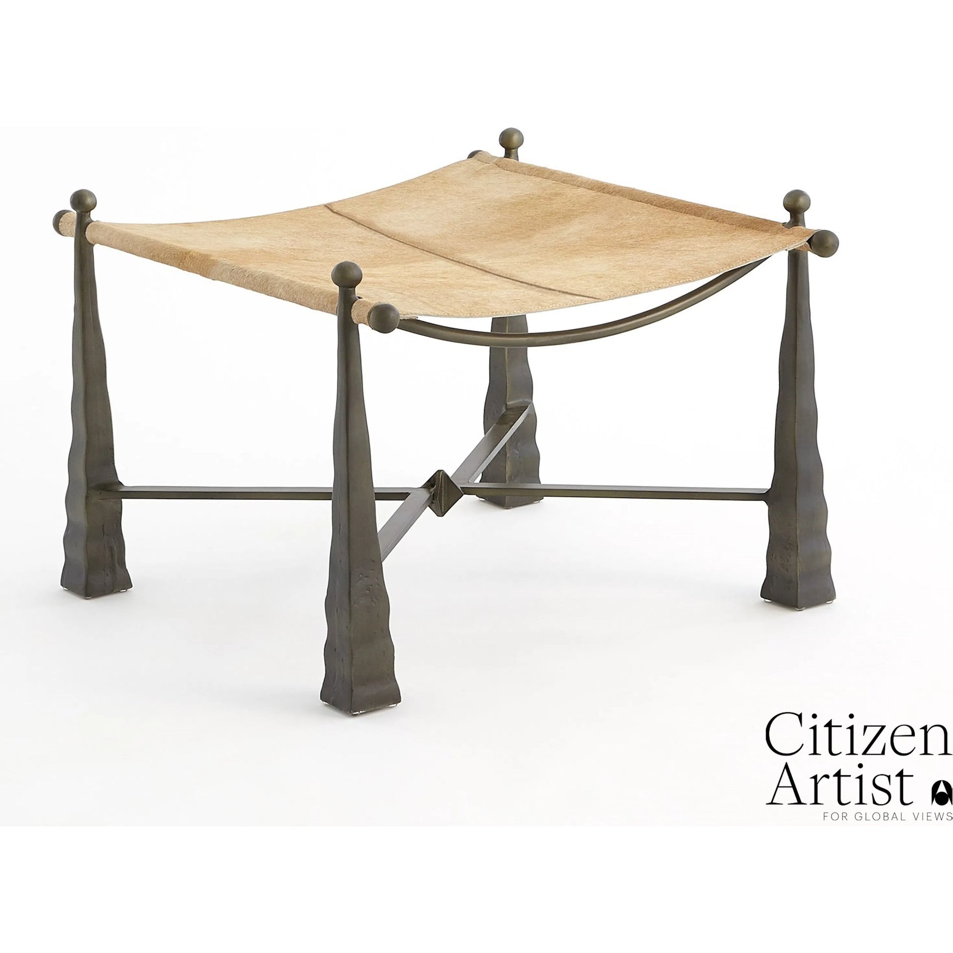 Cognac Ottoman by Global Views. Made from metal, cowhide in a rustic style.