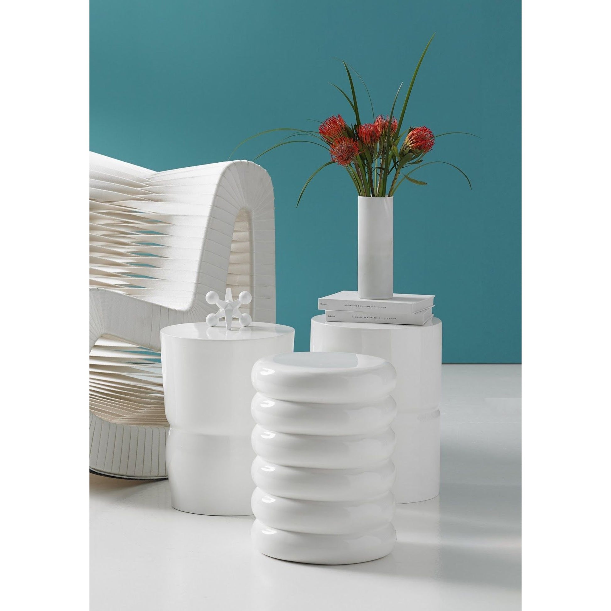Carved Stool by Phillips Collection. Made from resin in a modern style.