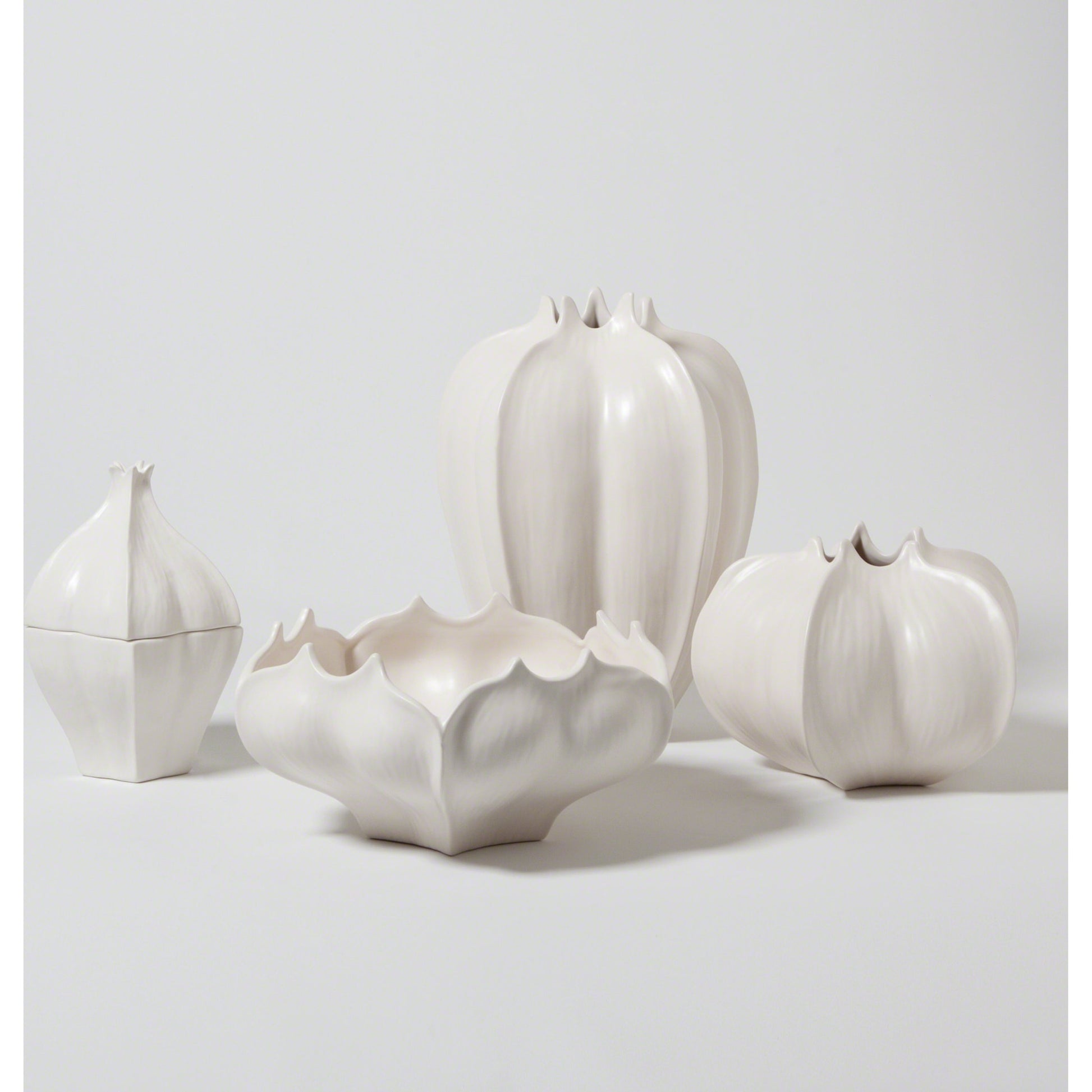 Star Fruit Bowl by Global Views. Made from ceramic in a coastal style.