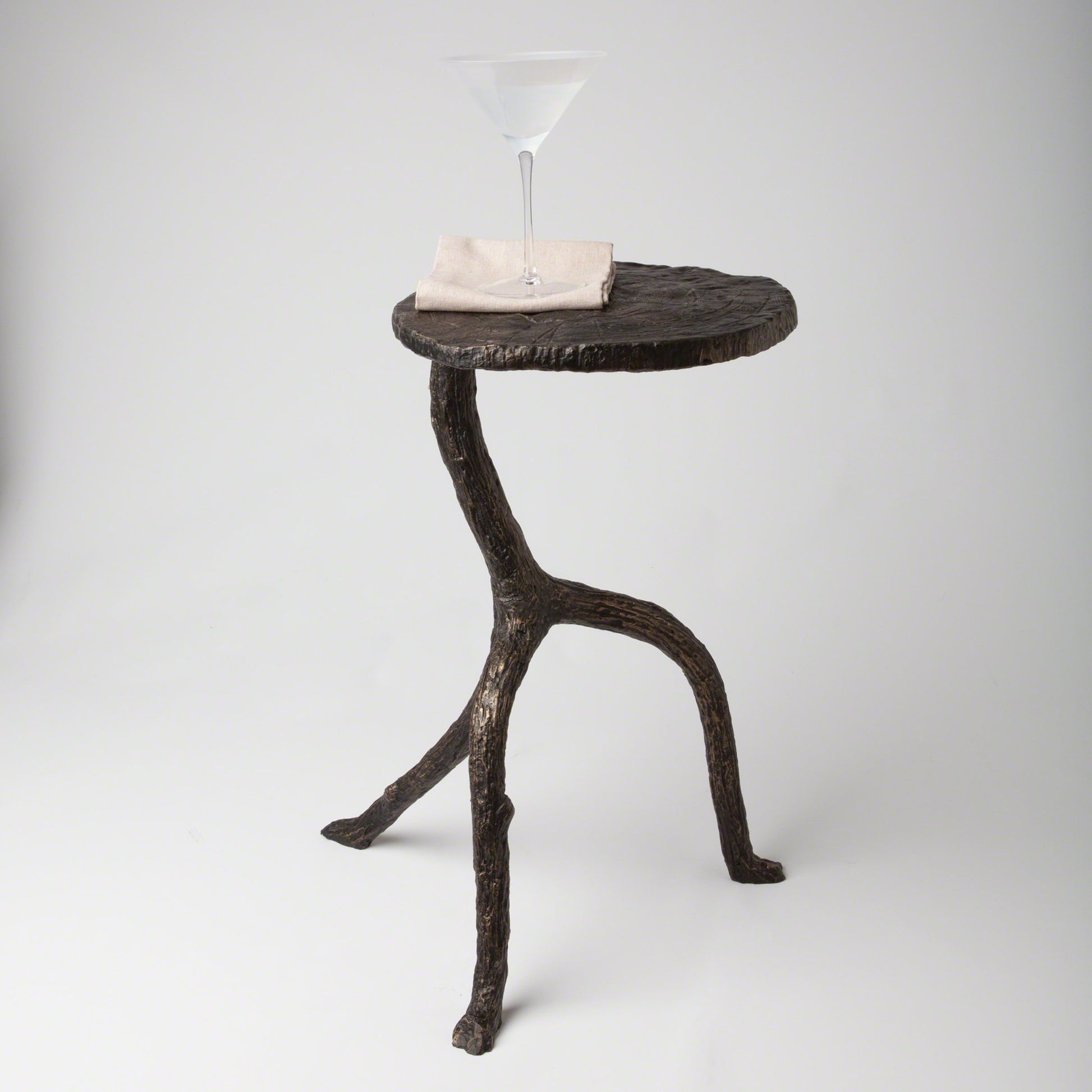 Wal Sticks Table by Global Views in antique bronze. Made from cast iron in a eclectic & global style.