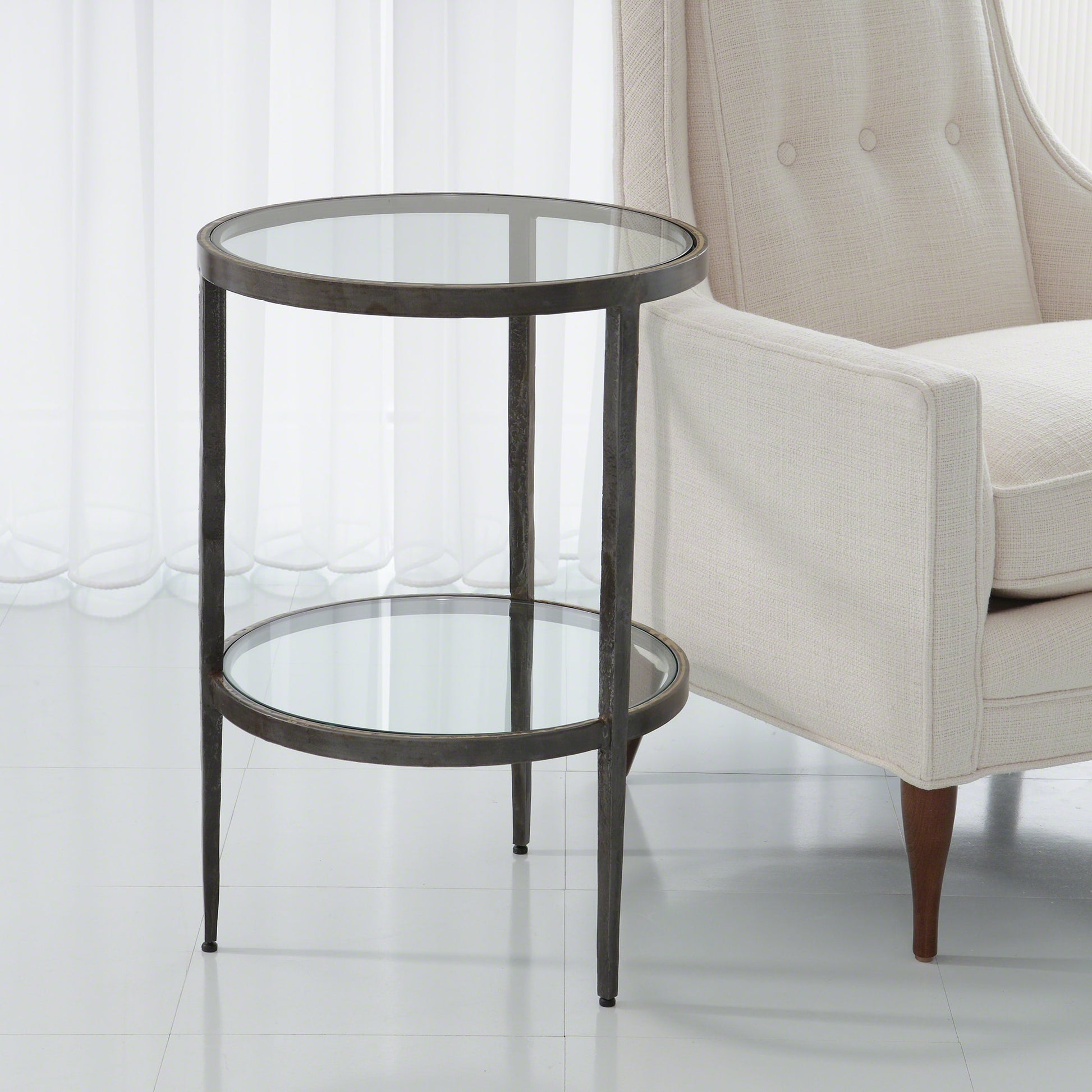 Laforge Side Table by Global Views. Made from iron, tempered glass in a transitional style.