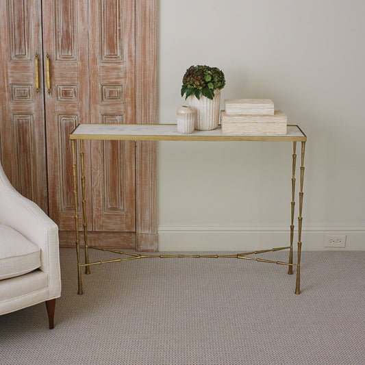 Spike Console by Global Views in antique brass. Made from iron, white marble in a transitional style.