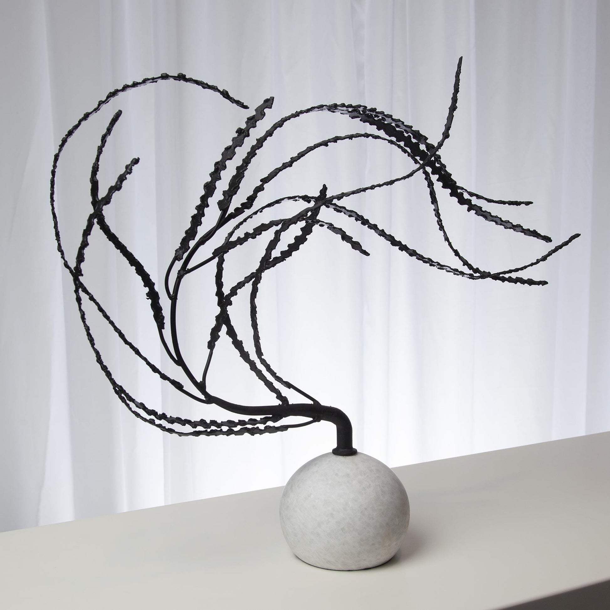 Thistle Sculpture by Global Views in black. Made from iron, white marble in a eclectic & global style.