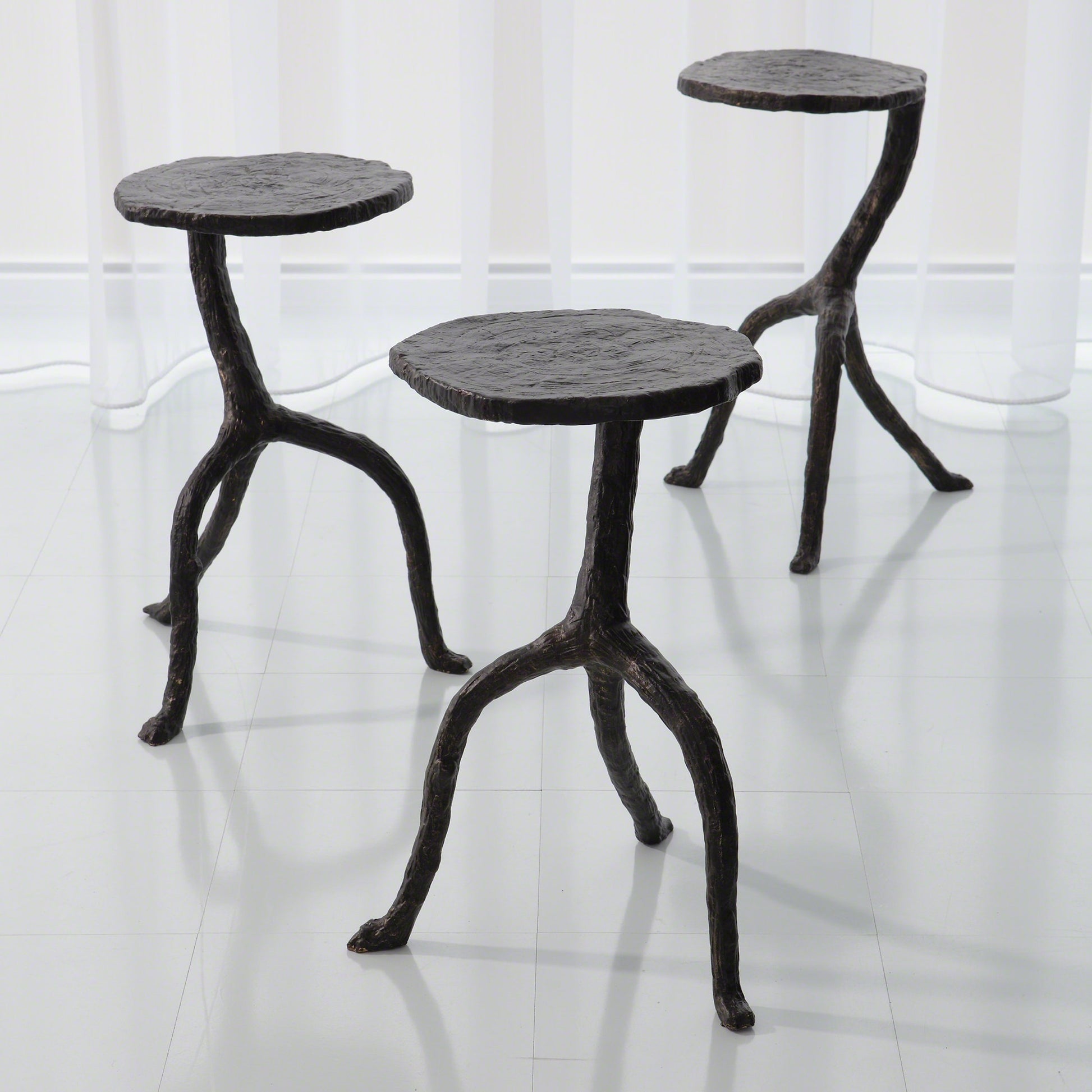 Wal Sticks Table by Global Views in antique bronze. Made from cast iron in a eclectic & global style.